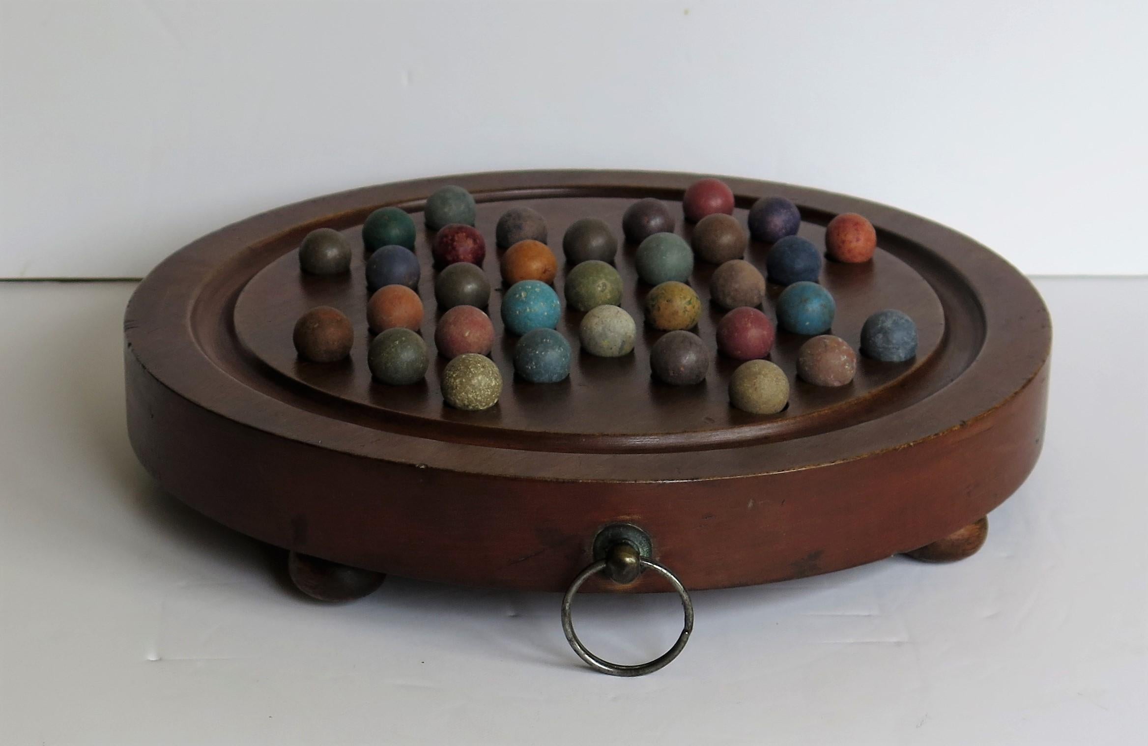 Marble Solitaire Hardwood Board with Hanging Ring 33 Clay Marbles, circa 1860 In Good Condition In Lincoln, Lincolnshire