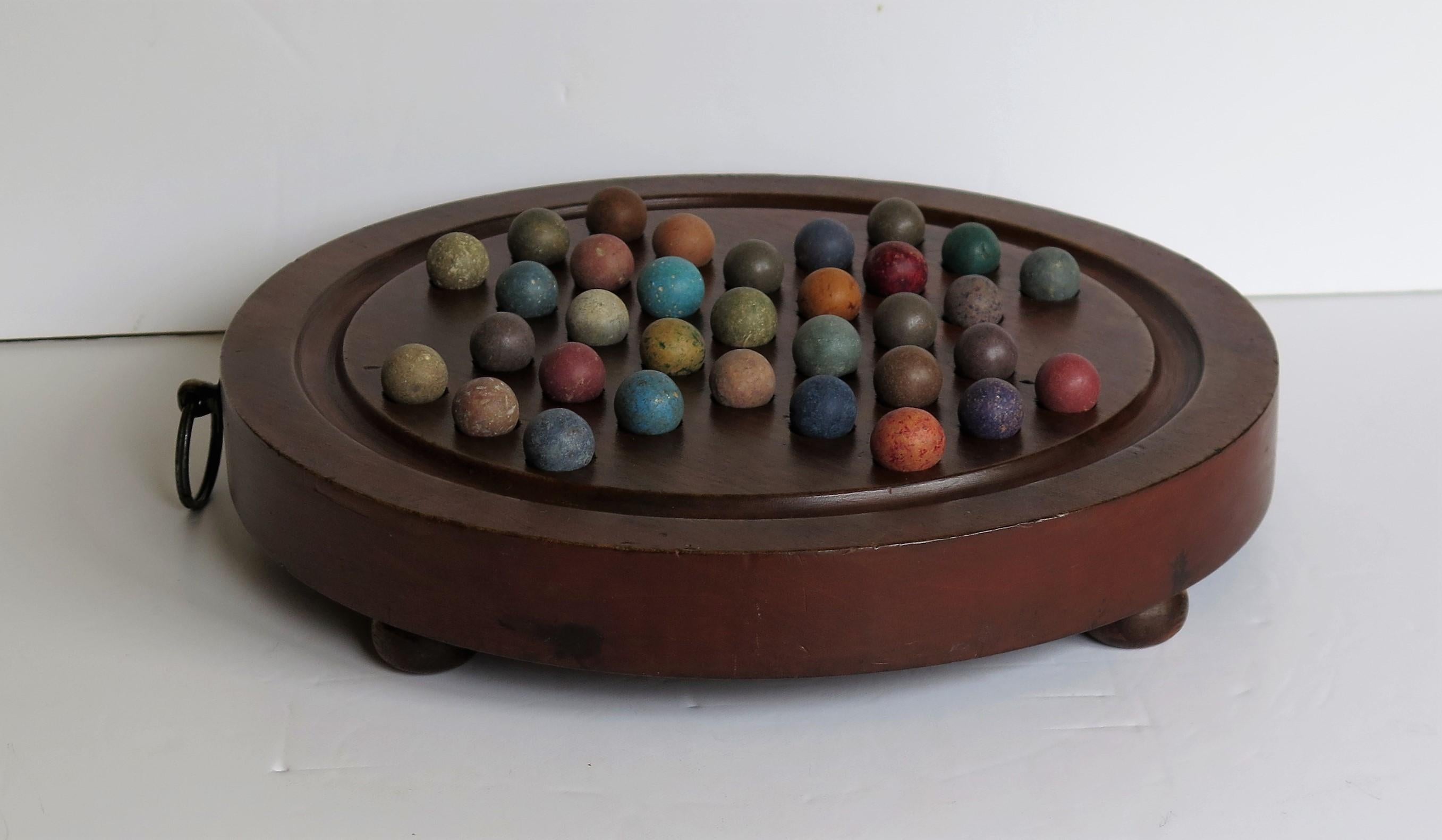 Stone Marble Solitaire Hardwood Board with Hanging Ring 33 Clay Marbles, circa 1860
