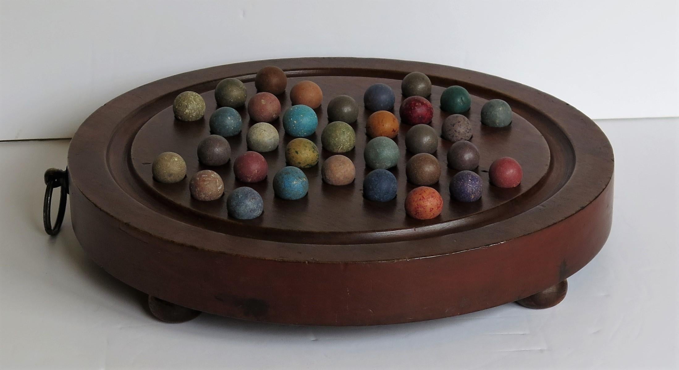 Marble Solitaire Hardwood Board with Hanging Ring 33 Clay Marbles, circa 1860 1