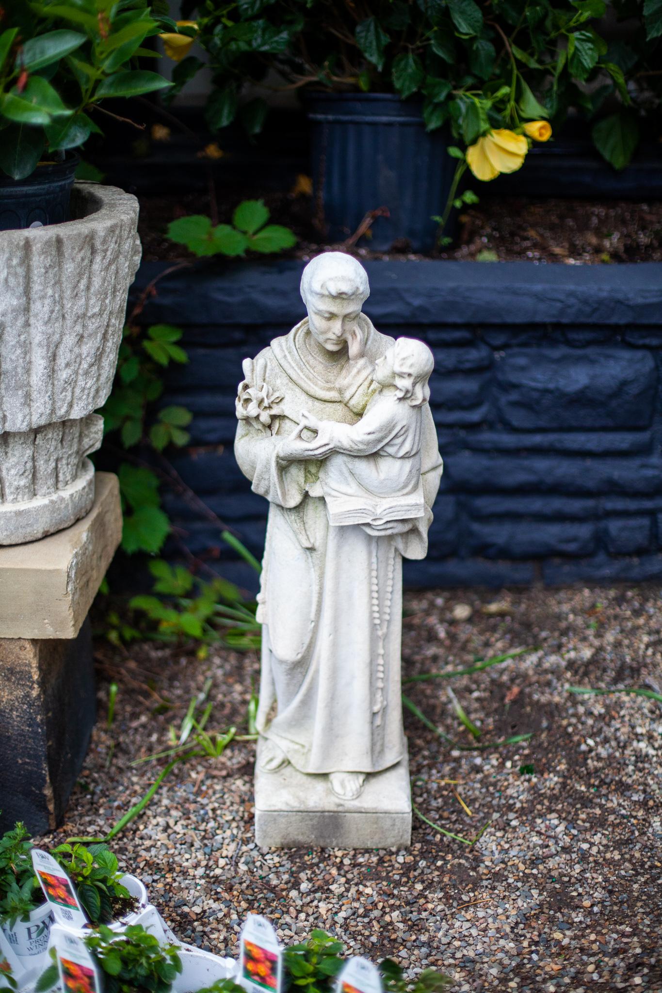 A wonderful ecclesiastical statue with a worn patina due to age. Perfect for the home or garden, fleurdetroit proudly offers up this marvelous decorative statue.