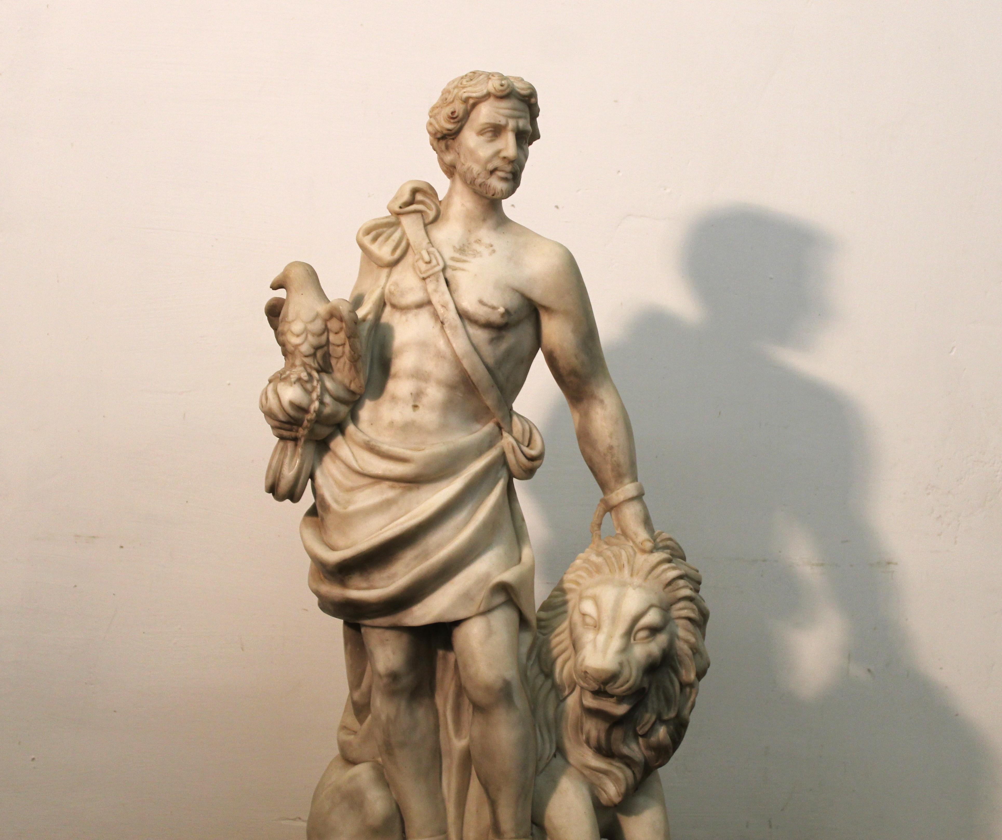 Marble statue of a warrior with a lion, 20th century, measures 98x39x30 cm.