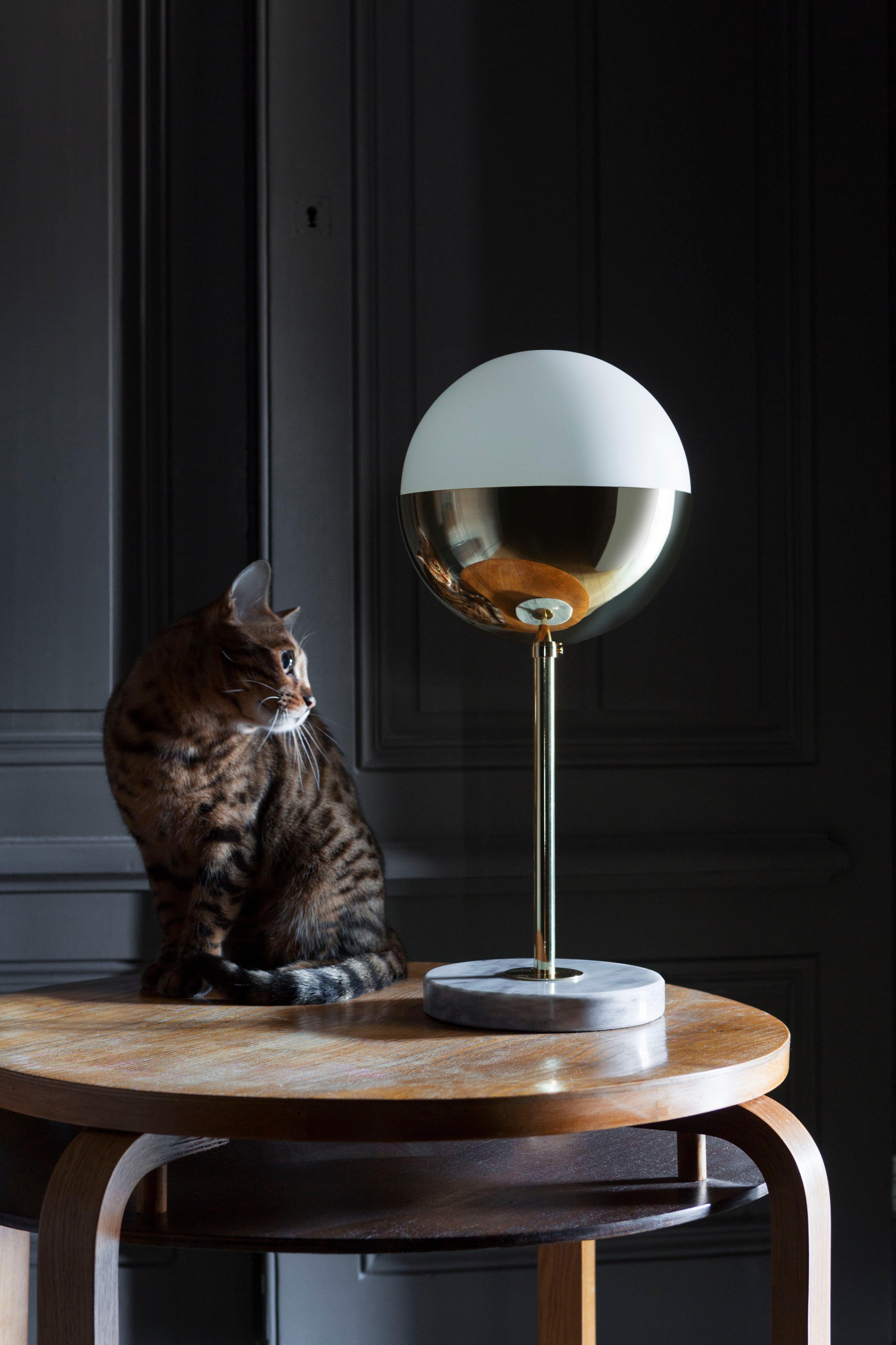 Marble table lamp 01 by Magic Circus Editions
Dimensions: H 50 x W 22 cm
 diameter spheres: 22 cm
Materials: Marble, Smooth brass, mouth blown glass
Dimmable version available.
Available Finishes: Brass, nickel
Available colors (central tube):