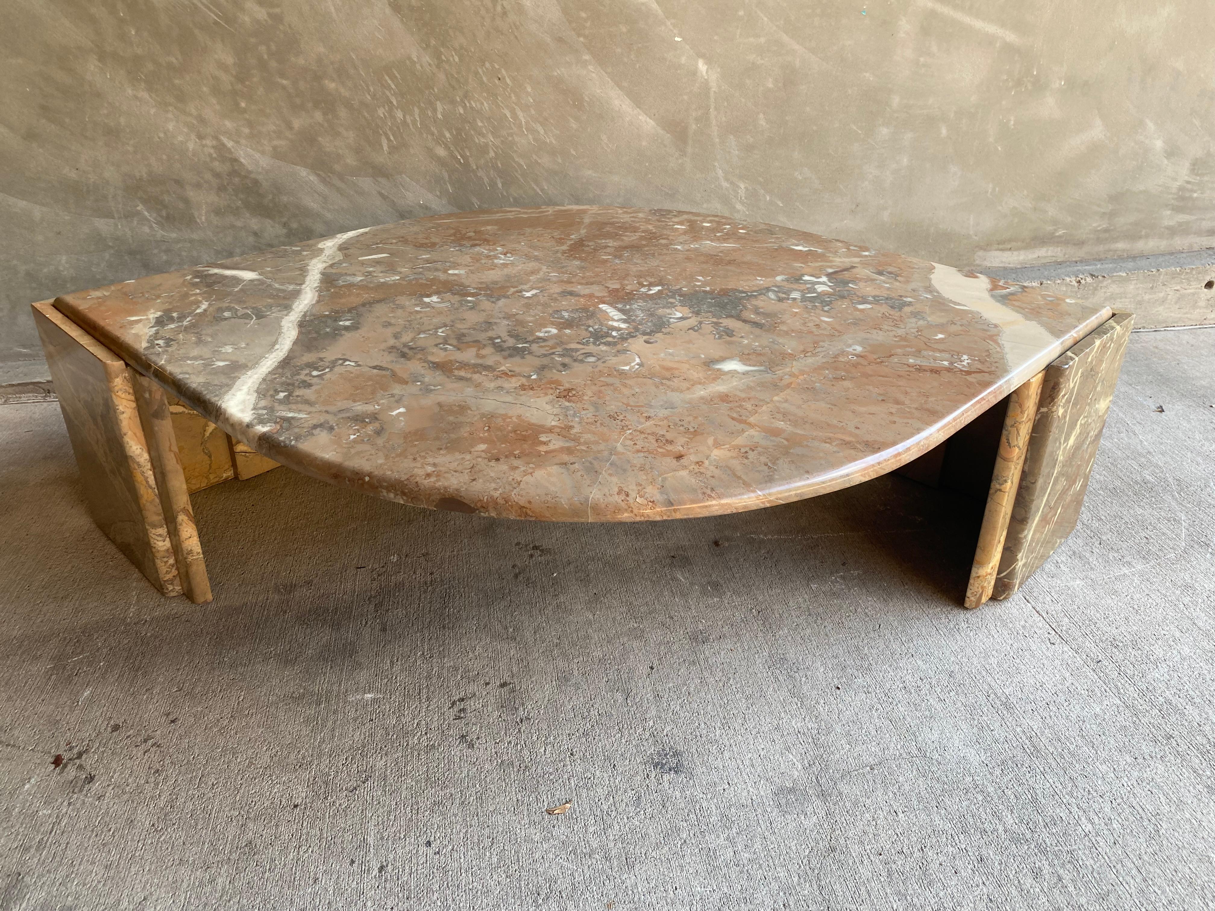 Sumptuous rust, sand and grey colored marble cocktail table. Teardrop shape with matching marble pedestals. Attr. Ligne Roset, France, 1980's.