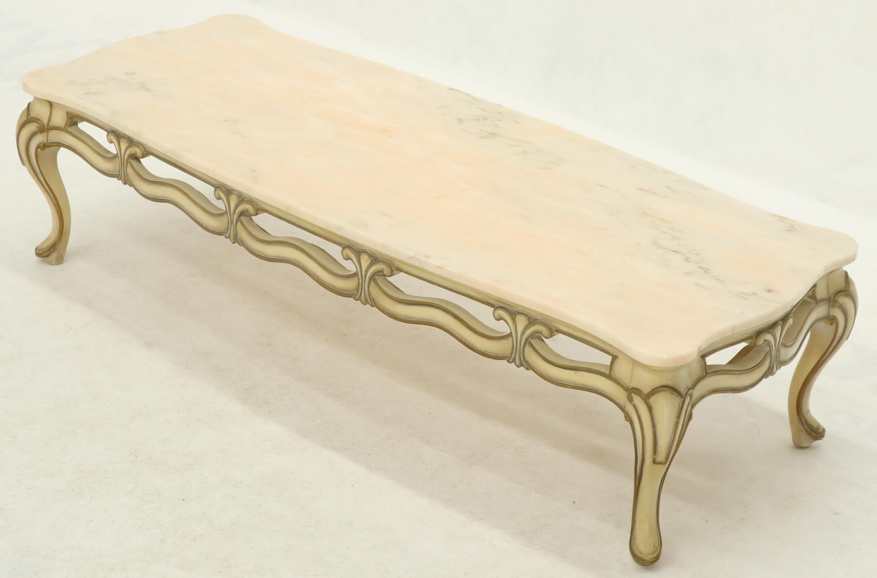 Decorator pale pink marble top cabriole leg French Provincial coffee table with elaborate pierced carving base.