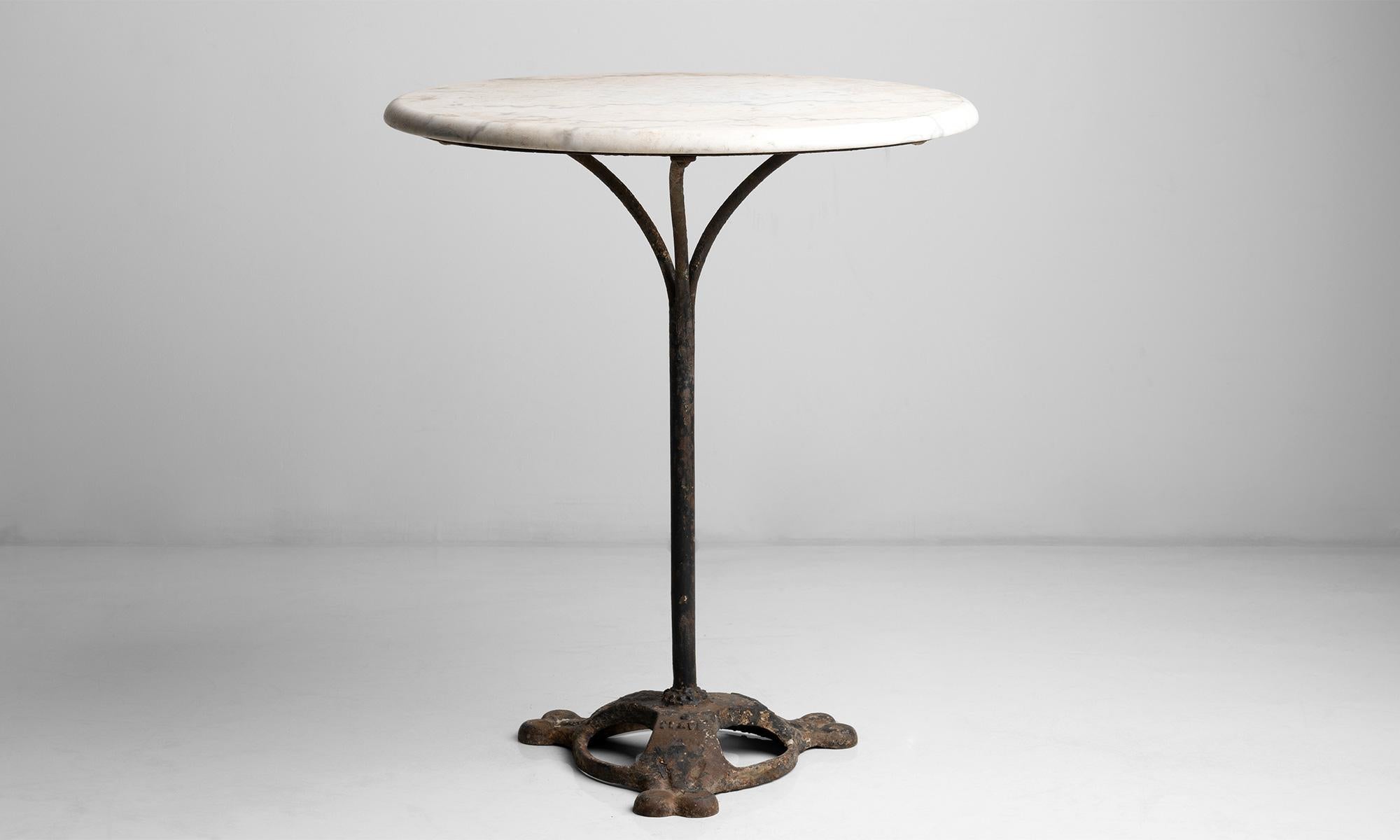Marble top bistro table.

France, circa 1890.

Marble top garden bistro table with iron stem and feet.

23.5”diameter x 27.5”height.