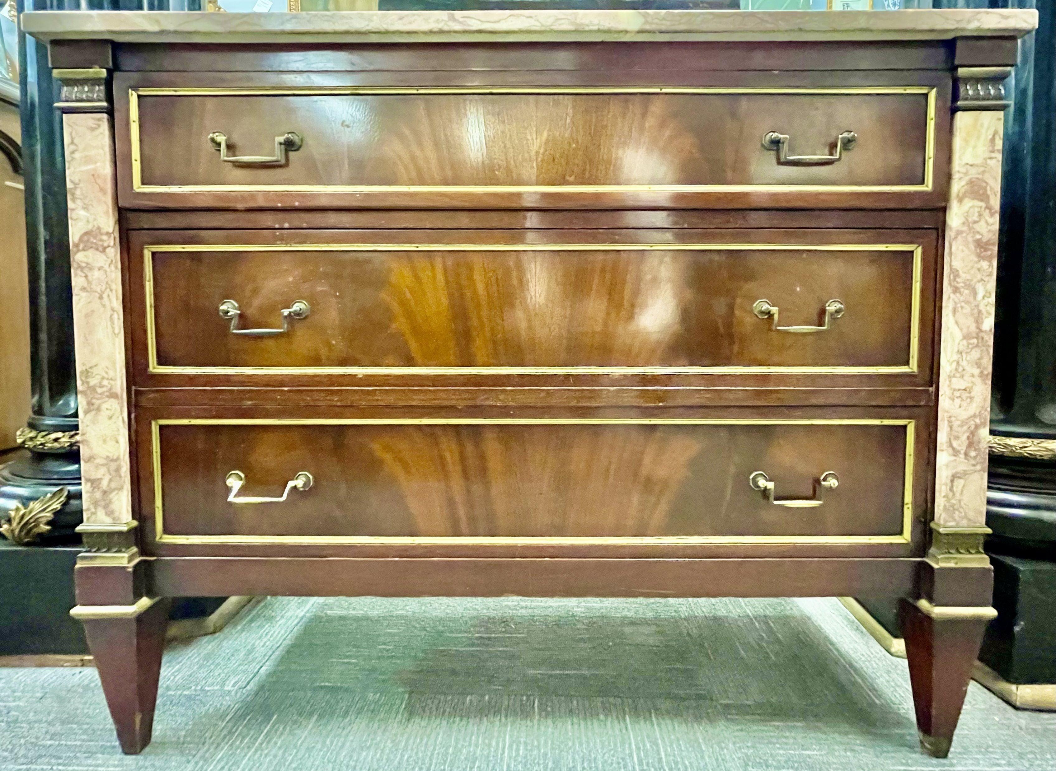 This Neoclassical style marble top bronze-mounted Maison Jansen fashioned marble column front commode. This rare and hard to find fine commode or night table having a pink and white veined marble top with matching column-form sides flanking a group