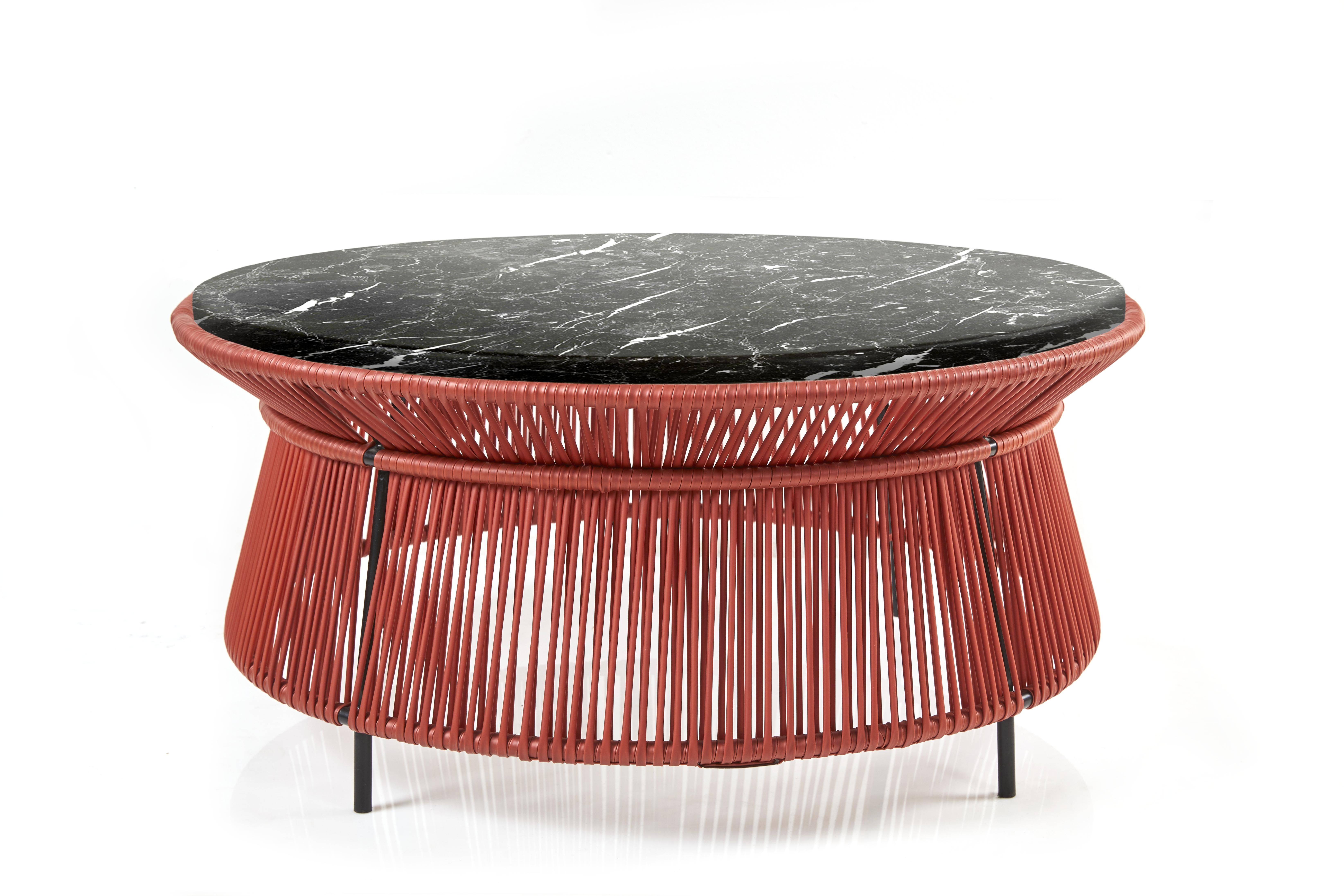 Marble Top Caribe Chic low table by Sebastian Herkner
Materials: Galvanized and powder-coated tubular steel. PVC strings are made from recycled plastic.
Technique: Made from recycled plastic and weaved by local craftspeople in Colombia.