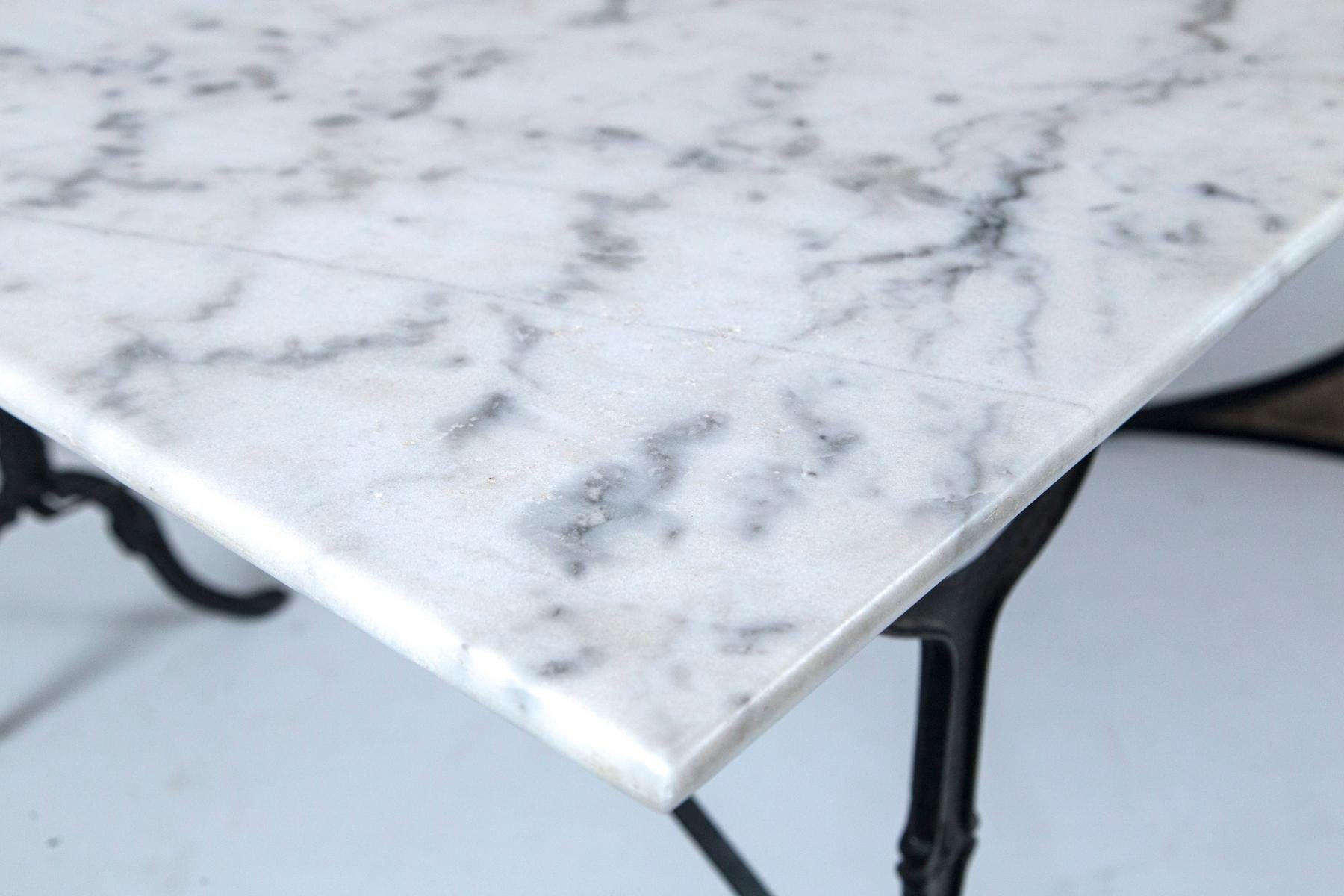 Marble Top Cast Iron Bistro Table, France, early 20th century. Carrara marble top on black iron base.