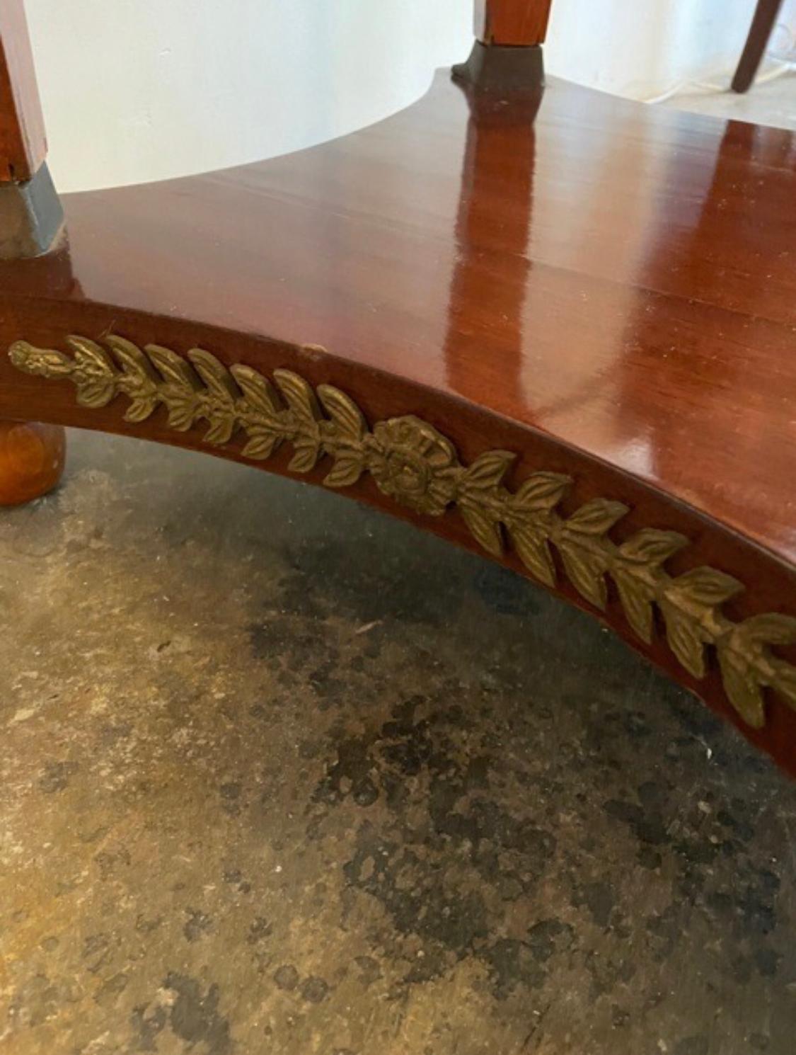 Marble top center table with applied bronze.
