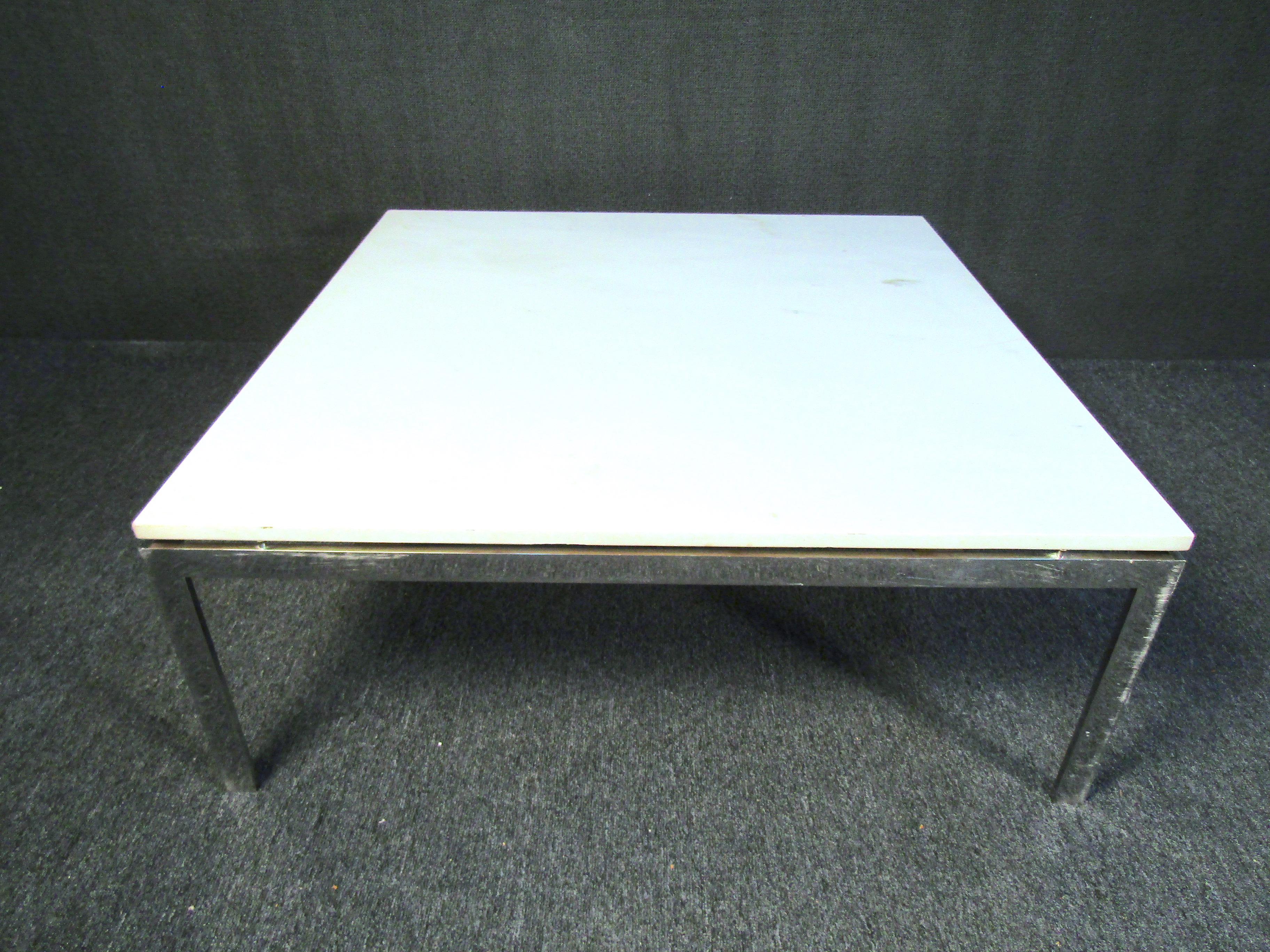 Mid-Century Modern square coffee table combining an elegant marble top with a chrome base. This striking combination of materials and classic design by Milo Baughman makes for an interesting piece that is sure to stand out in any room. Please
