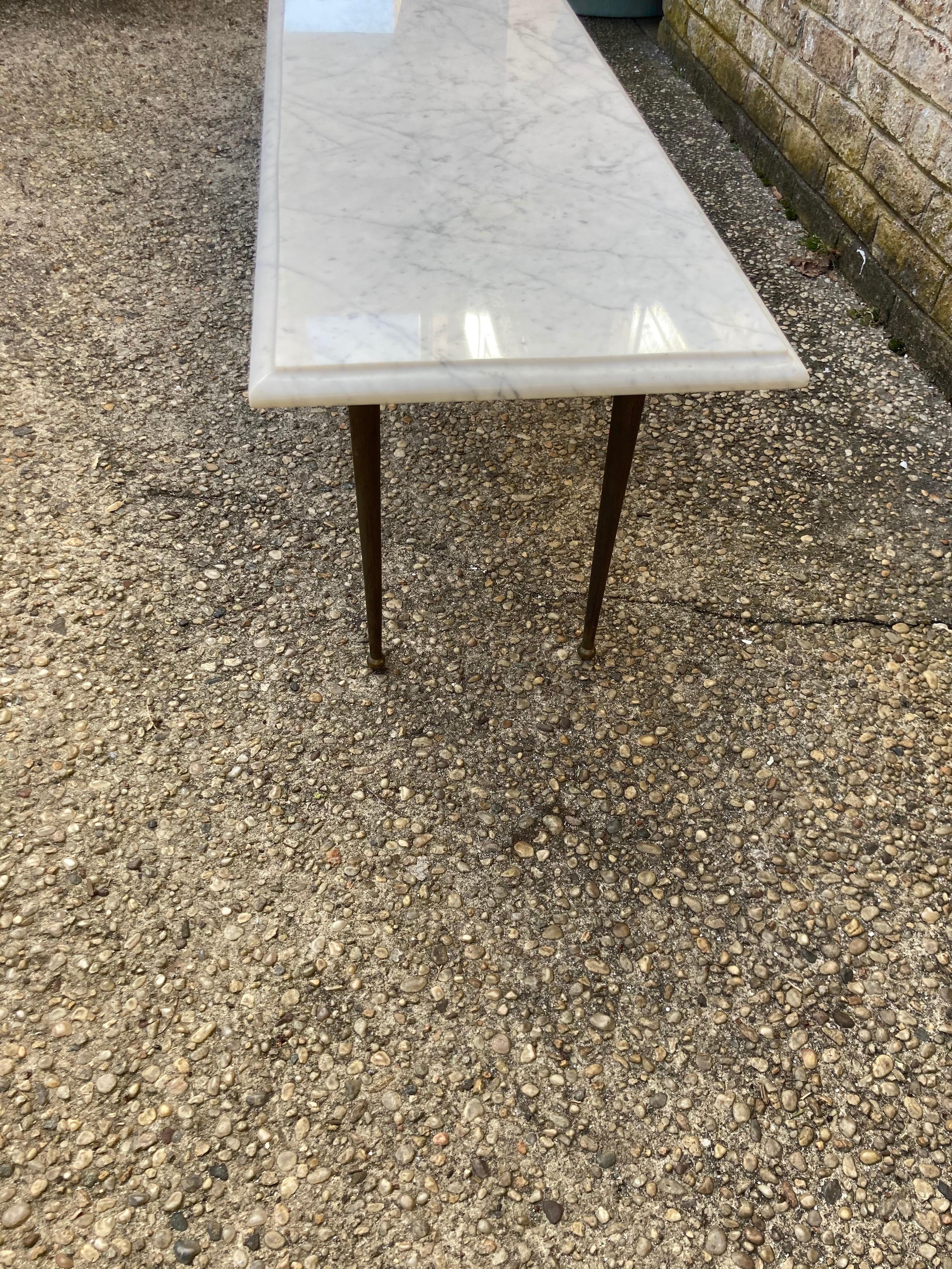 Fabulous long narrow coffee table / bench with a white / gray marble top with brass tapered and reeded legs ....a very unique size.