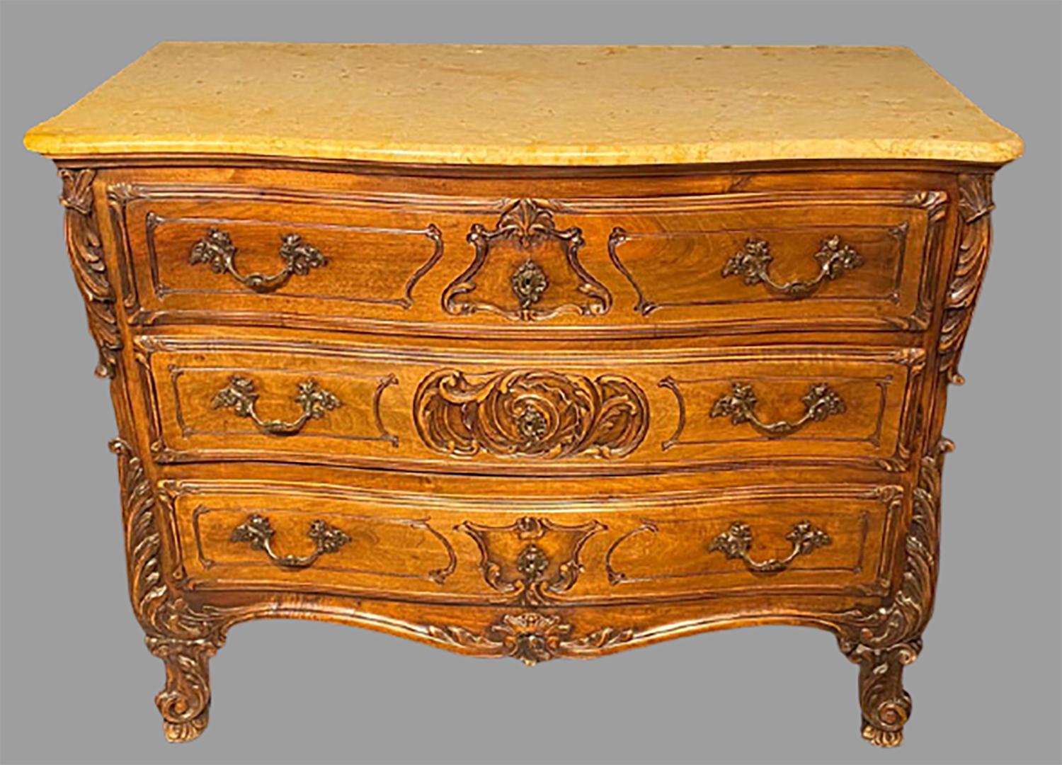 Marble top commode, chest or dresser in the Louis XV style dating from the late 19th century. This large and impressive commode is magnificently carved in the Rococo taste sporting a finely designed marble top. The front and back column sides are