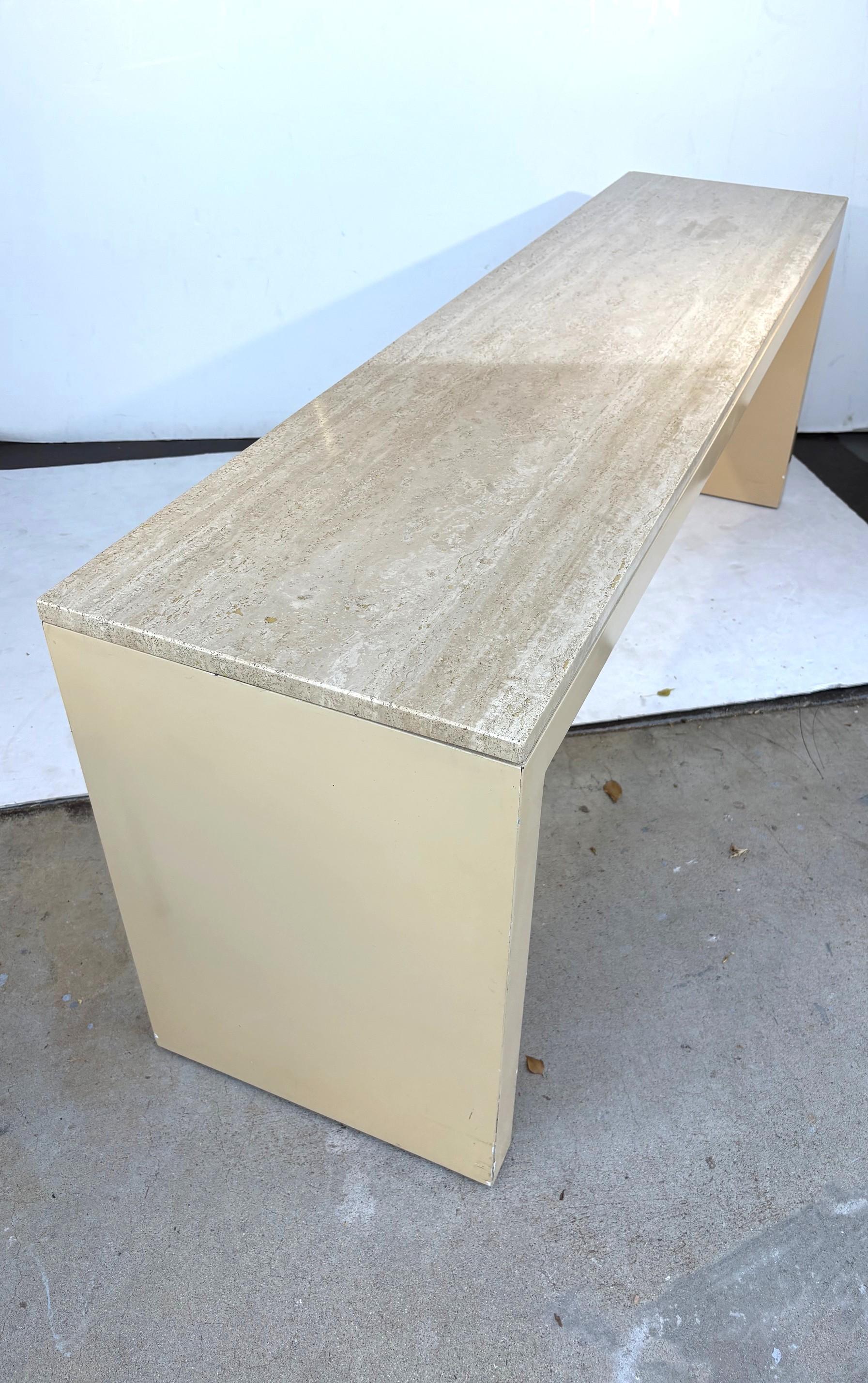 A marble top console table or sofa table. 
