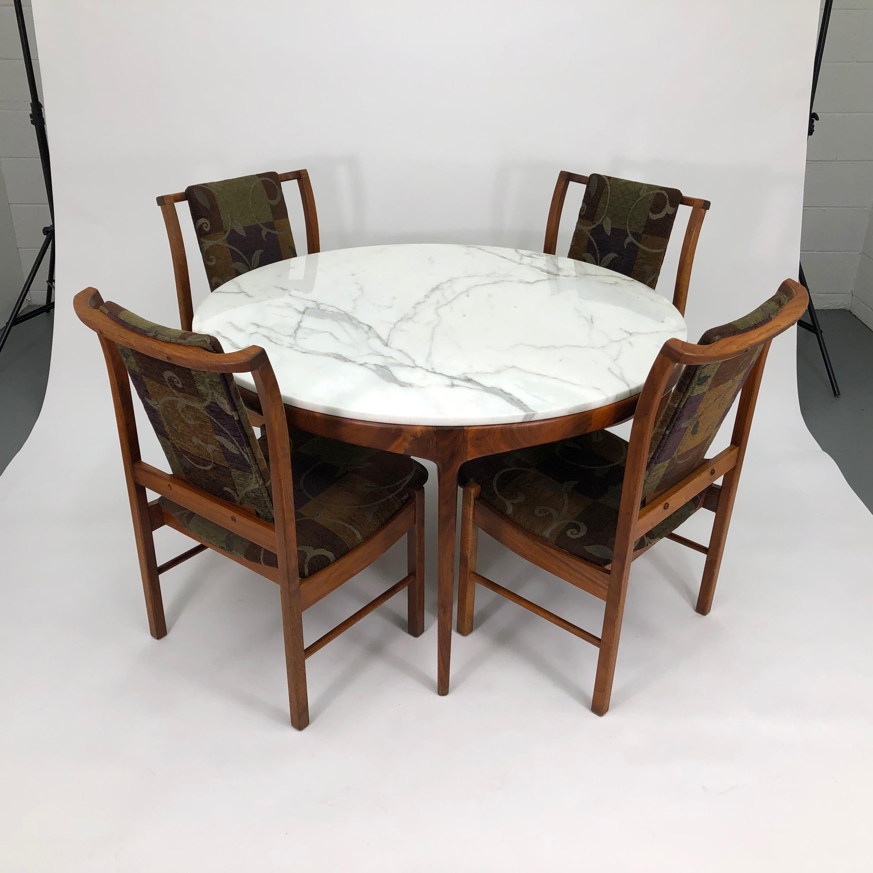 A rare Carrara marble and walnut dining table and chairs for Lane's 'Rhythm' series. 

Custom ordered for the sole previous owner by the Denver Design Center in the mid-1960s.

This beautiful edition is perfectly made for intimate dinners - or