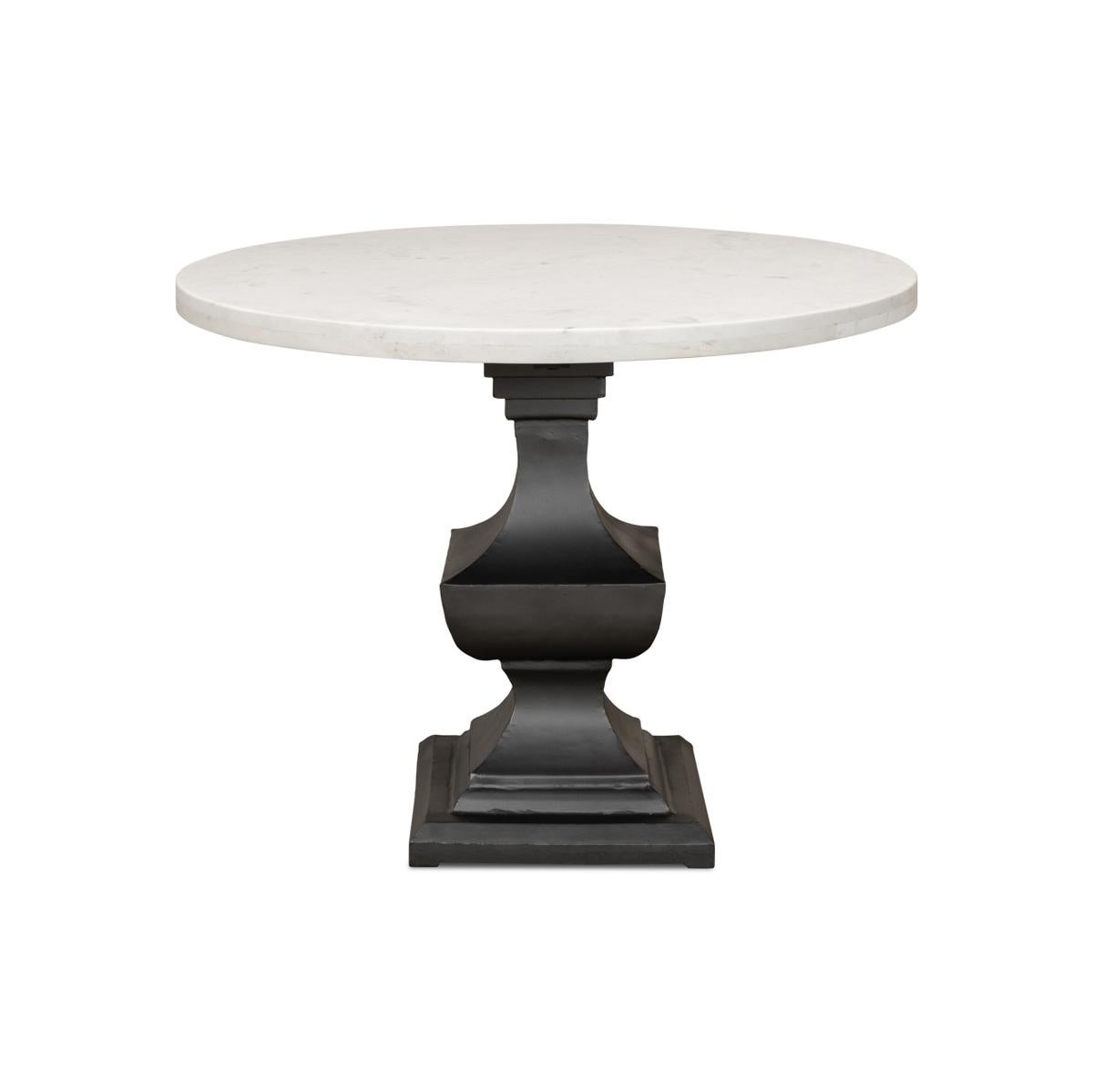 Marble top dining table, a wonderful piece that is sure to elevate any dining room. This table boasts a smooth and gleaming 40-inch round white marble top that sits atop a metal pedestal base. The base is finished in a chic gunmetal color and is