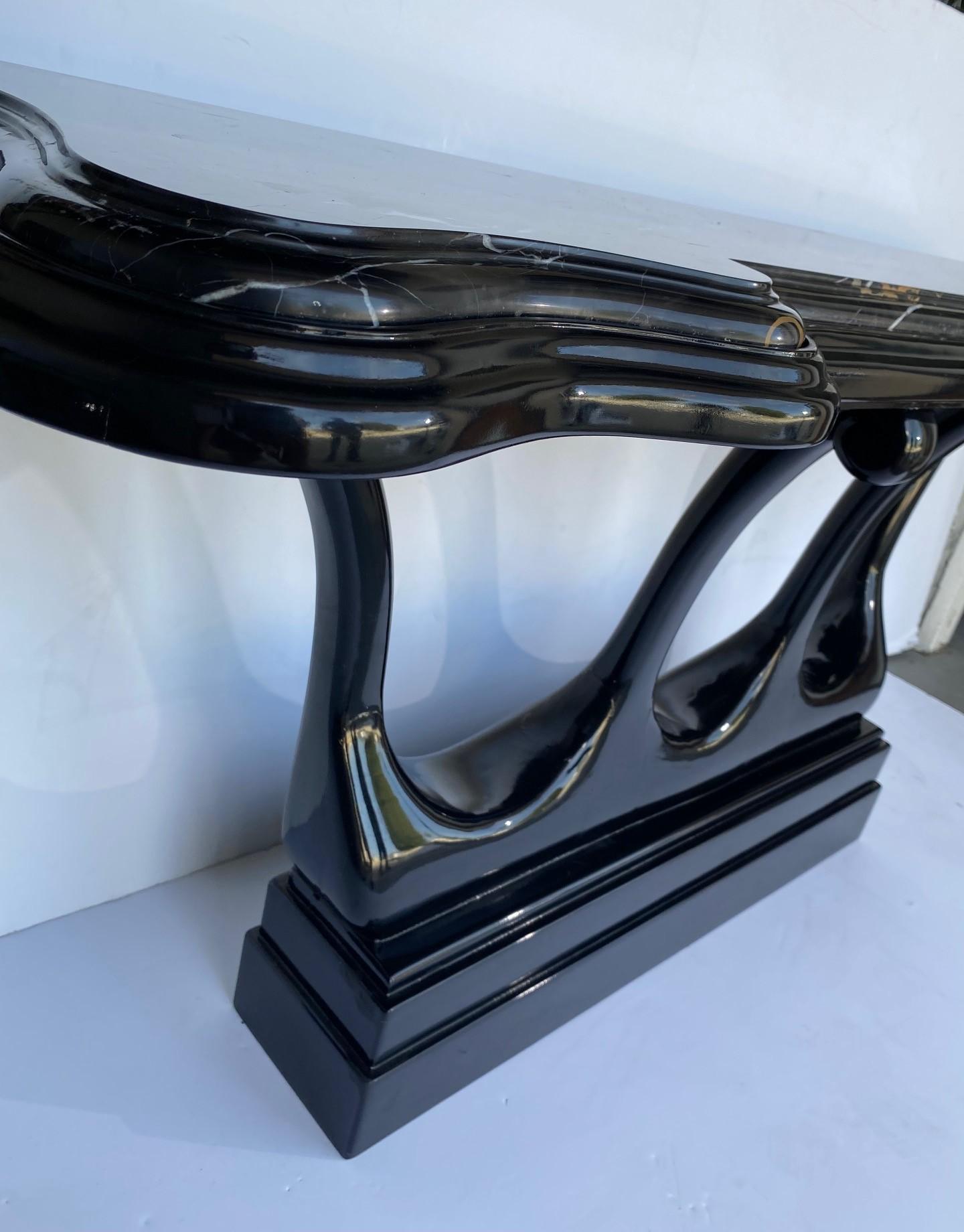 An Italian marble top lacquer finish base console table.