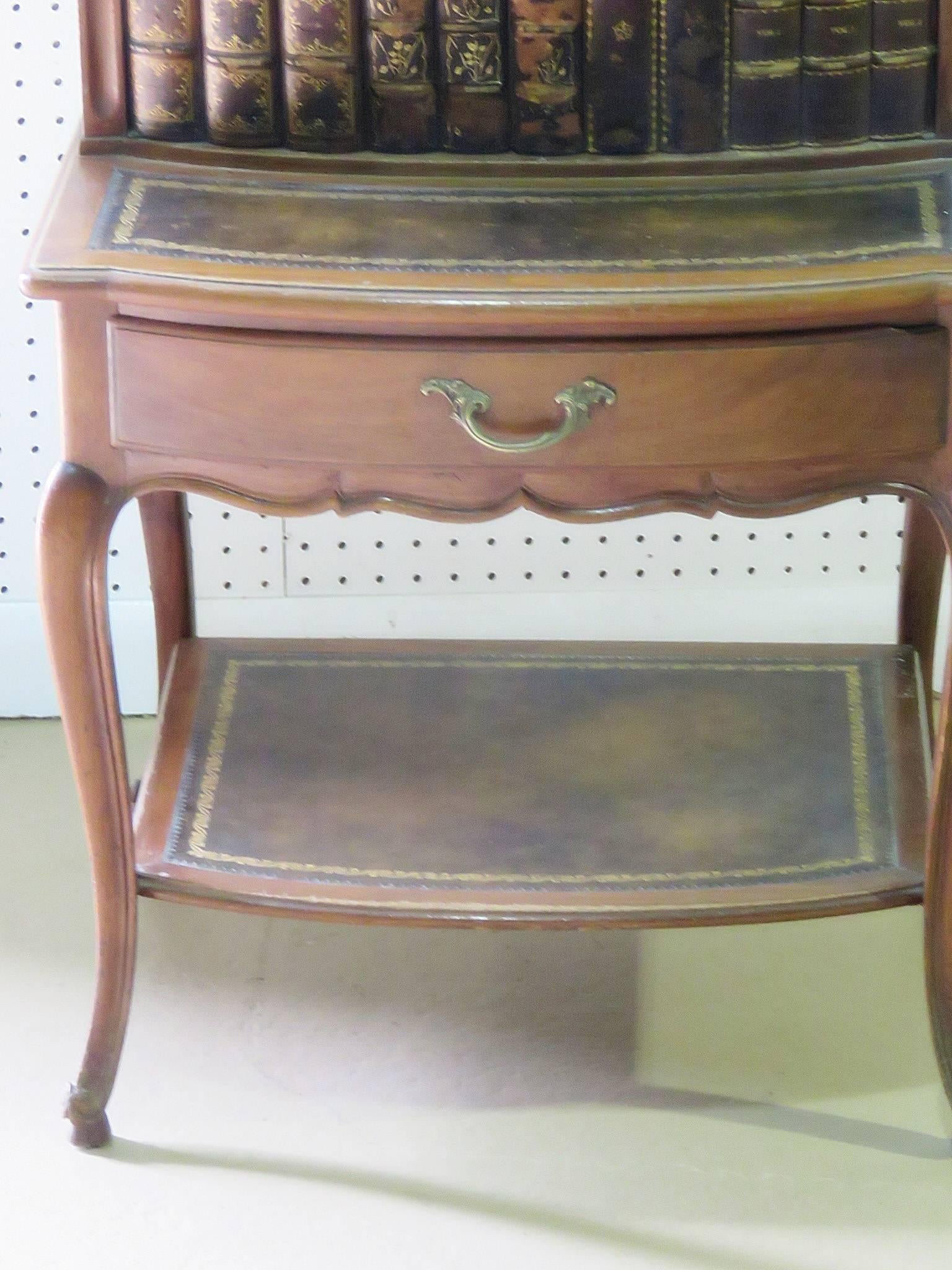 Louis XV style leather trimmed marble-top step end table. Two doors over one drawer with a brass gallery.