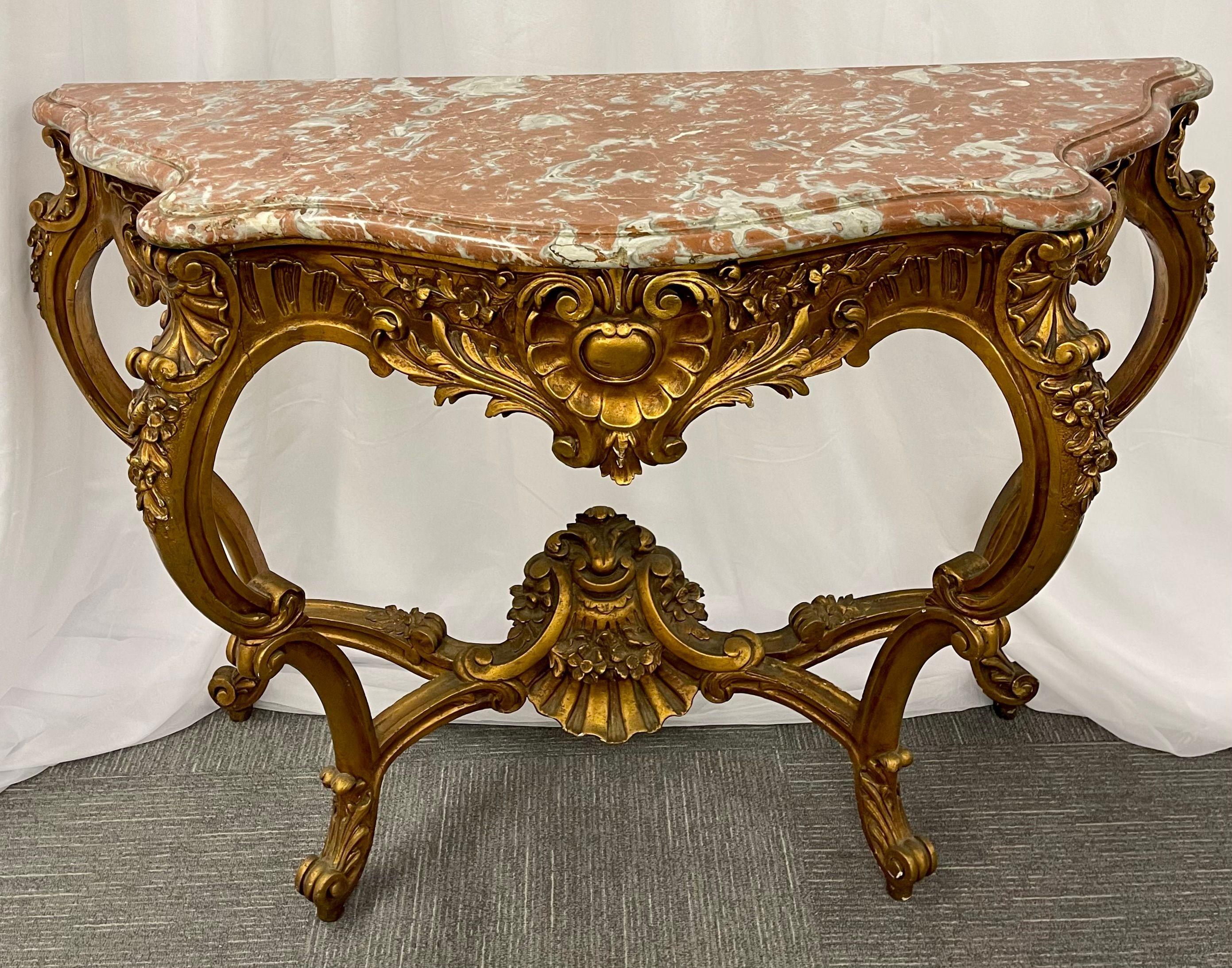 Marble-top Louis XV style console table by Jansen. This is a fine and early example of French design at its best. This Louis XV style console has a deep serpentine design leg with a lower support under-carriage displaying a shell design with flowing