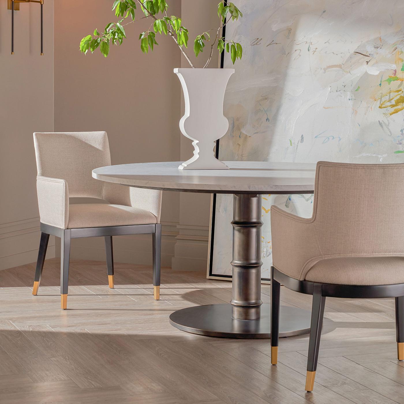 This exquisite piece features a luxurious white marble top, providing a smooth, refined surface that radiates sophistication. 

The contrasting finishes between the sleek marble and the sturdy, organically shaped base create a captivating focal