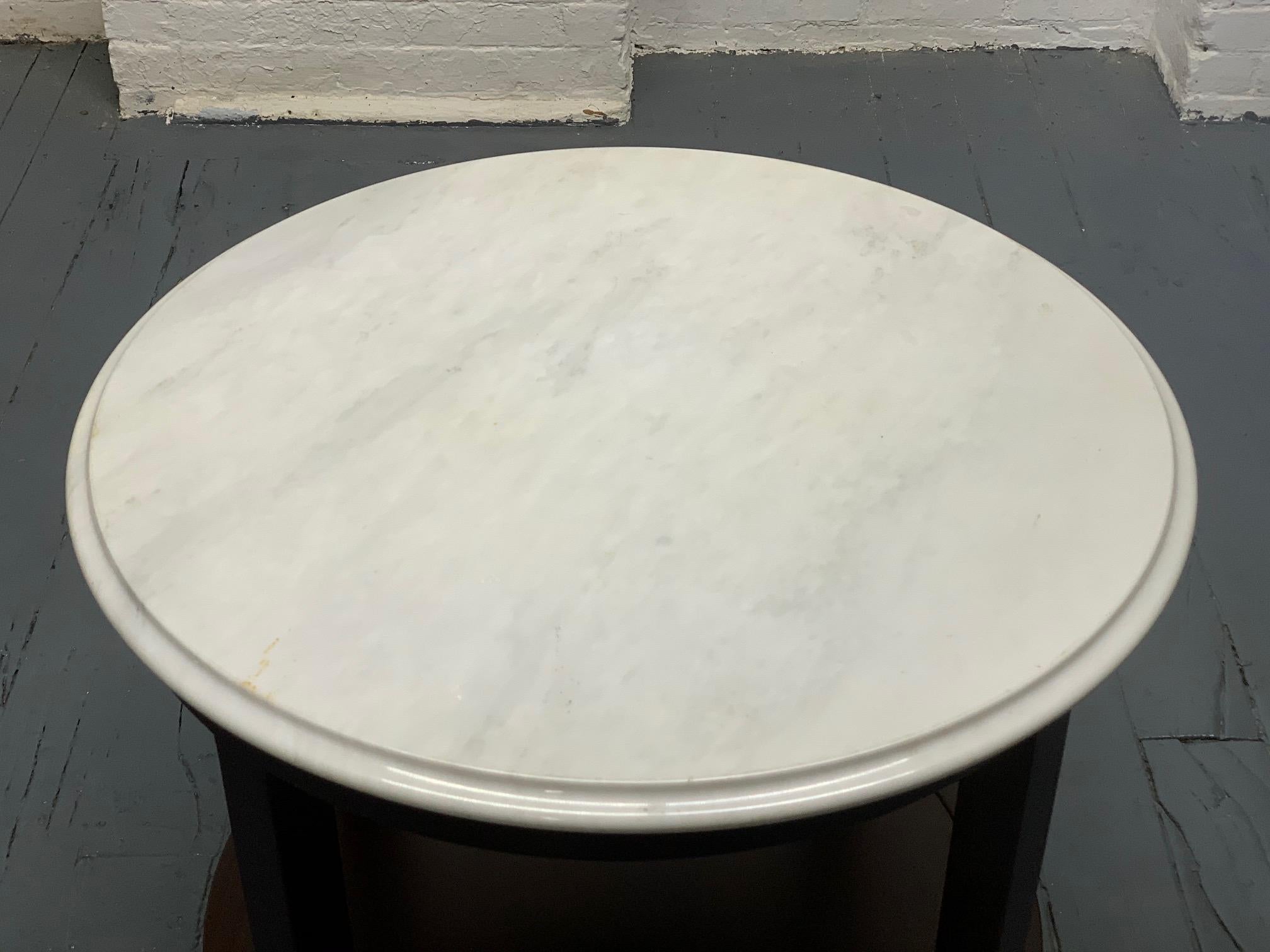 Marble-top side table by Baker Furniture Company.