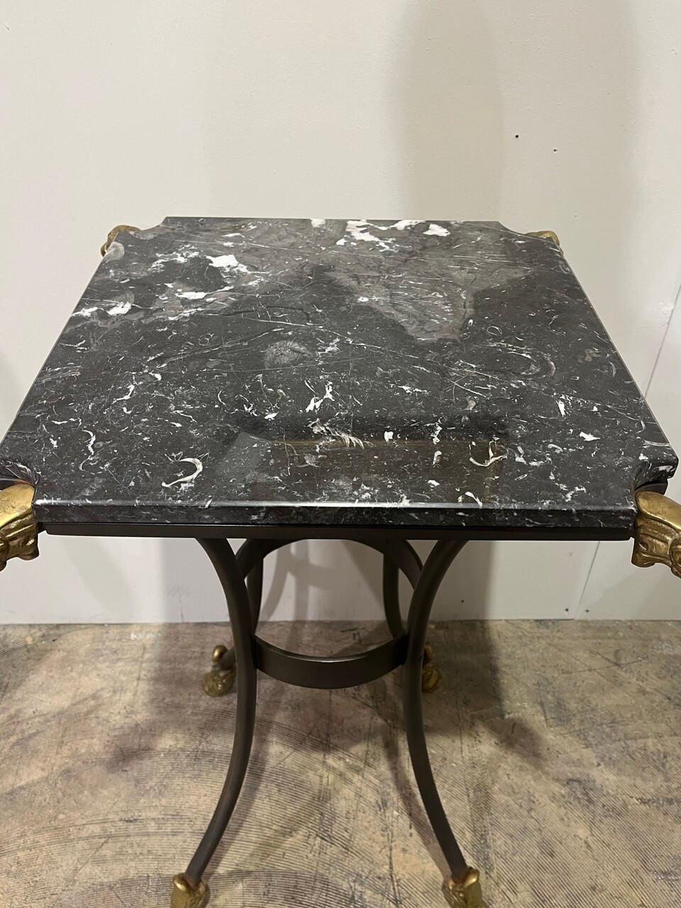 Elevate your space with the Marble Top Side Table featuring exquisite neoclassical design. Adorned with intricately crafted Bronze Rams Heads and Hoofed Feet, it seamlessly blends classical elegance with contemporary charm. The luxurious marble top