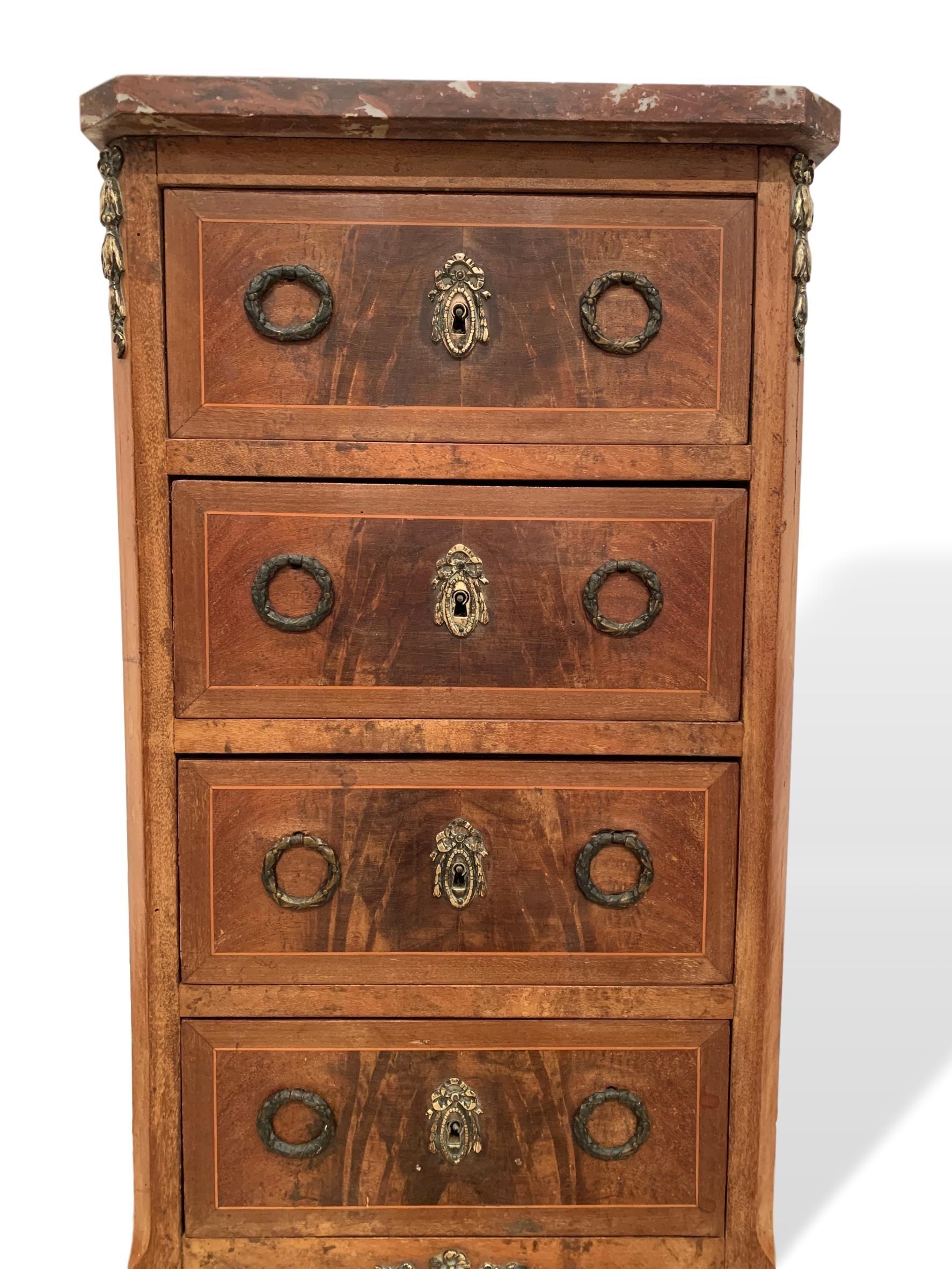 Marble-top small lingerie chest in exotic woods, Italian, circa 1920, marble top with canted corners, over a case fitted with four drawers, rising on cabriole legs, ending in sabots. The wood is rich and has a lovely warm patina. 

Measures: 37