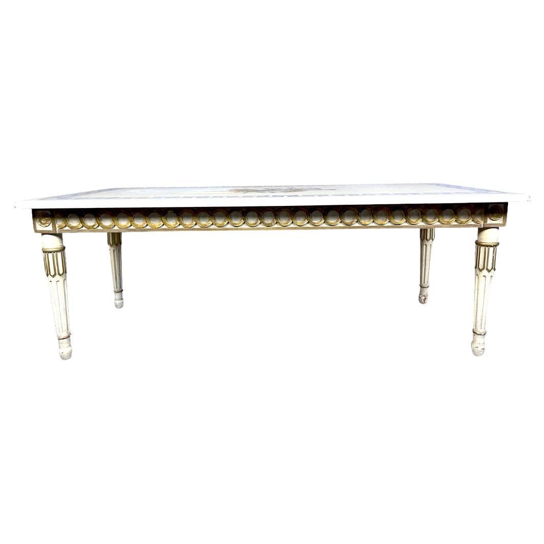 Marble top white and gilt coffee table with Greek key and decorative inlay 
Pretty 1940s Italian marble top with blue Greek key design and musical instruments inlay.