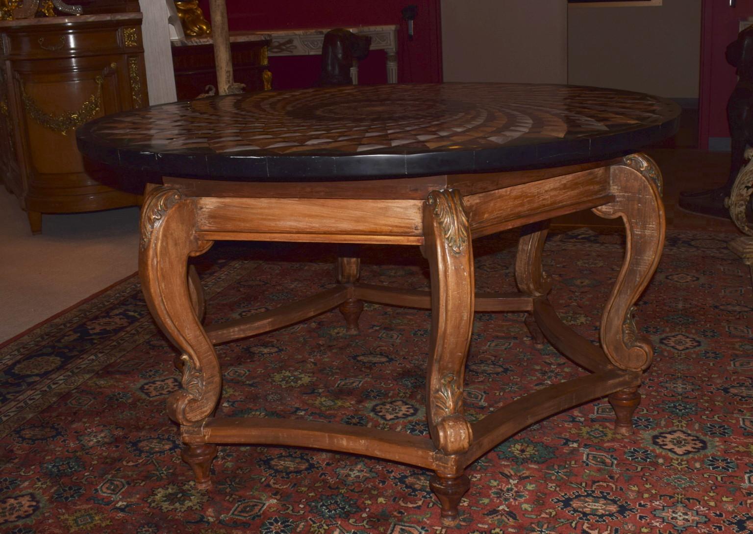 Unusual center table with amazing inlaid marble top on a fine hand-carved wood base.