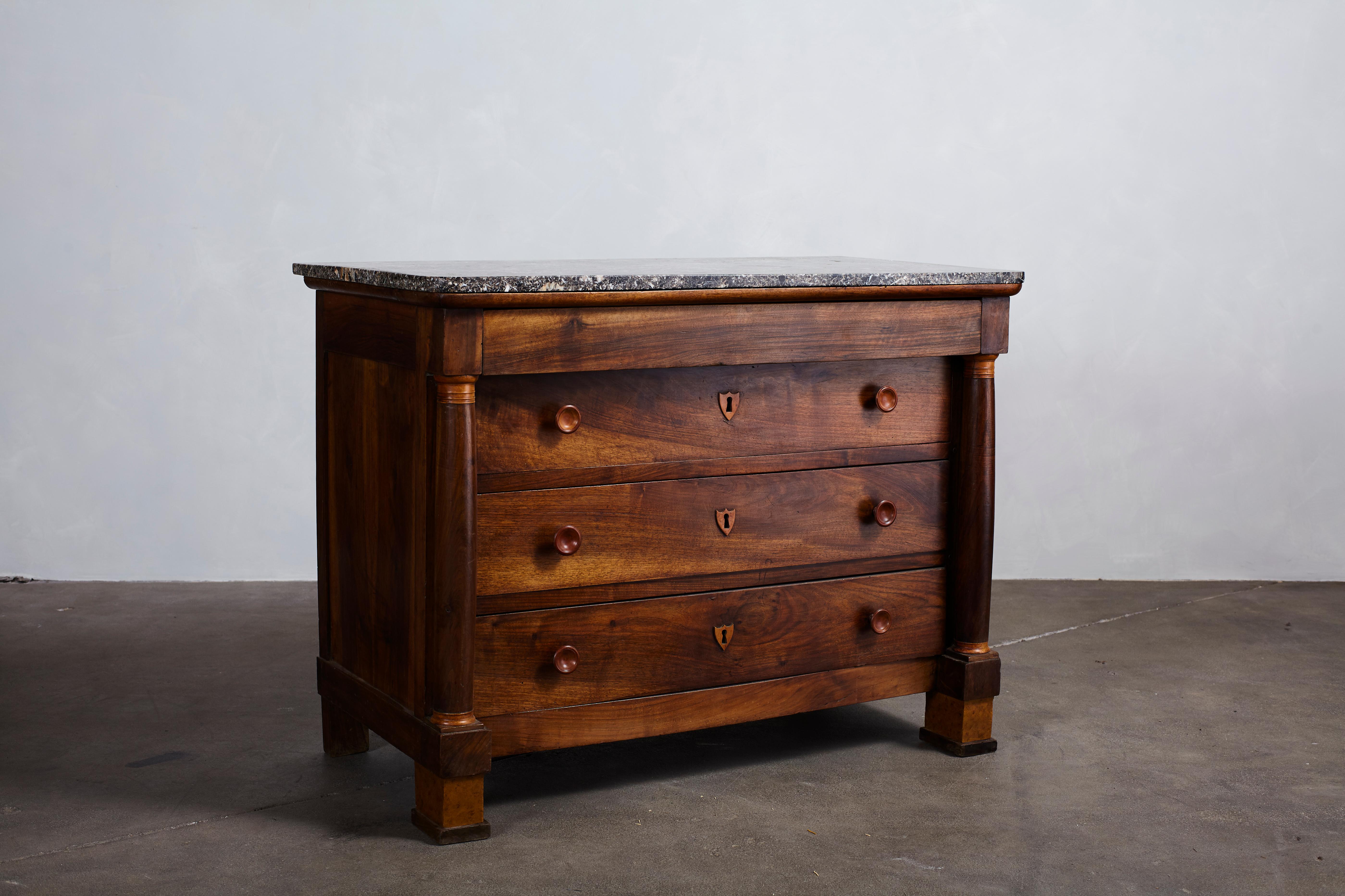 Marble Topped Four-Drawer Dresser with wood Detailed Key Holes 1