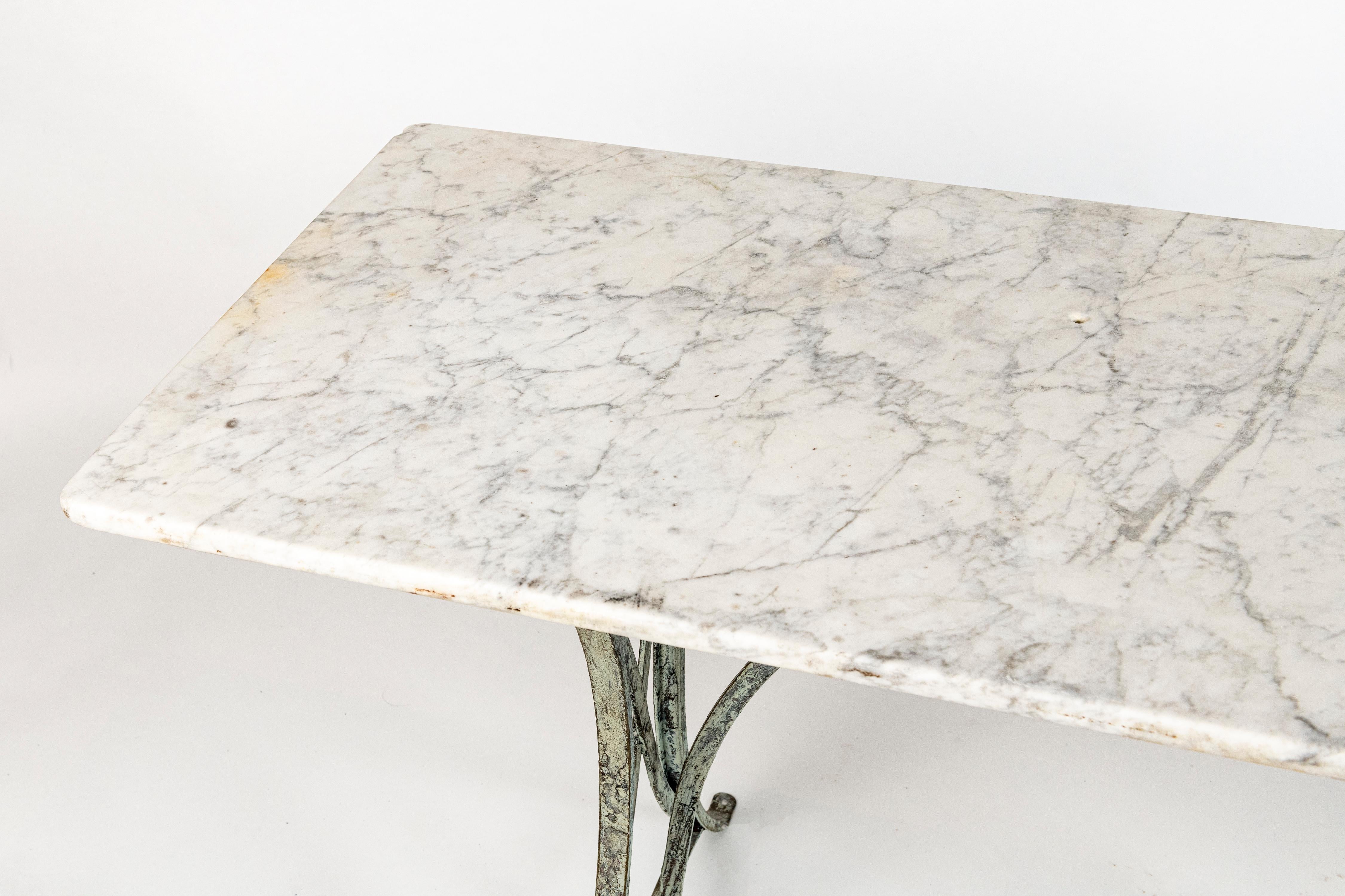 French Marble topped table, Verdis wrought iron base, can be used inside outside.