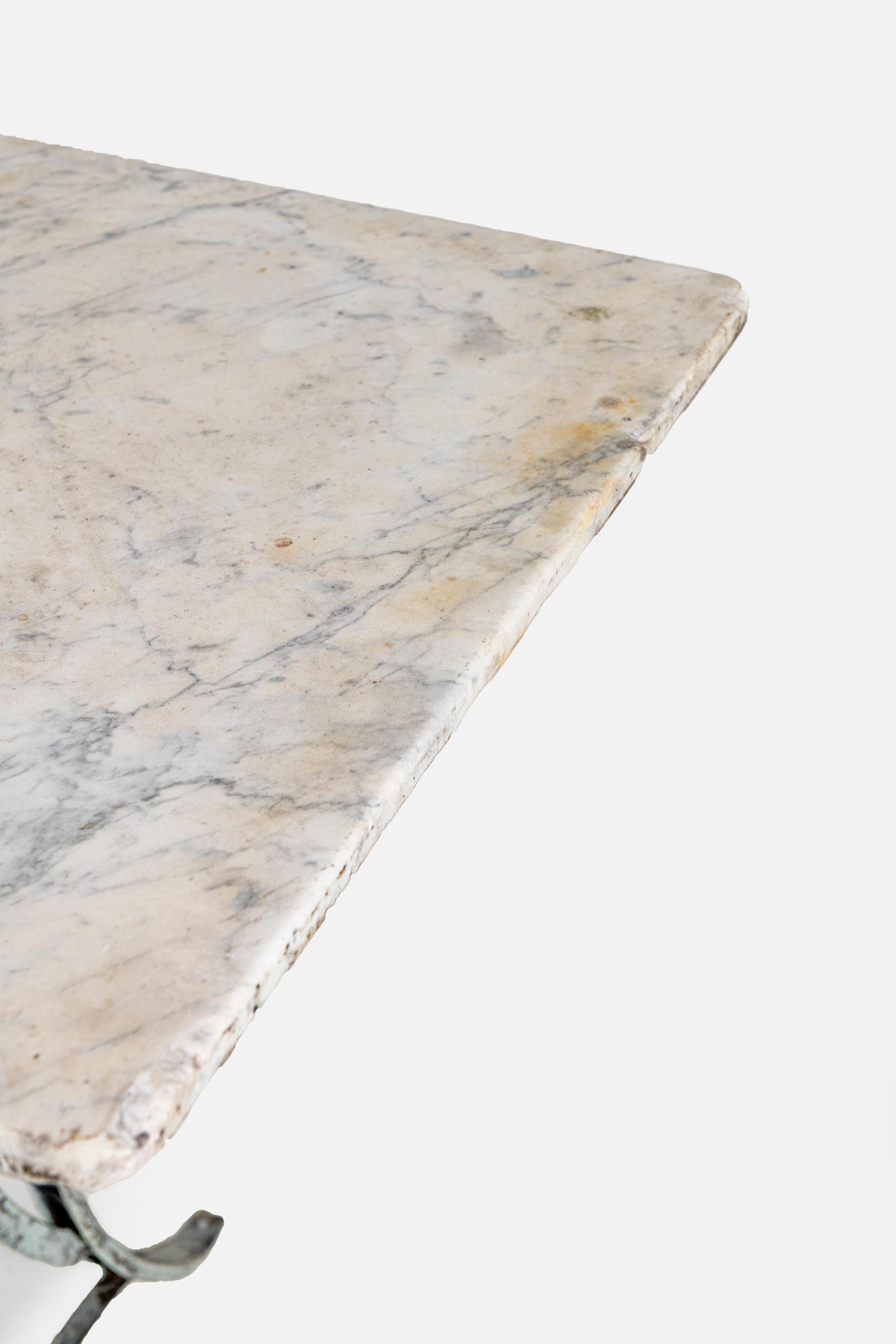 Marble topped table, Verdis wrought iron base, can be used inside outside. 1