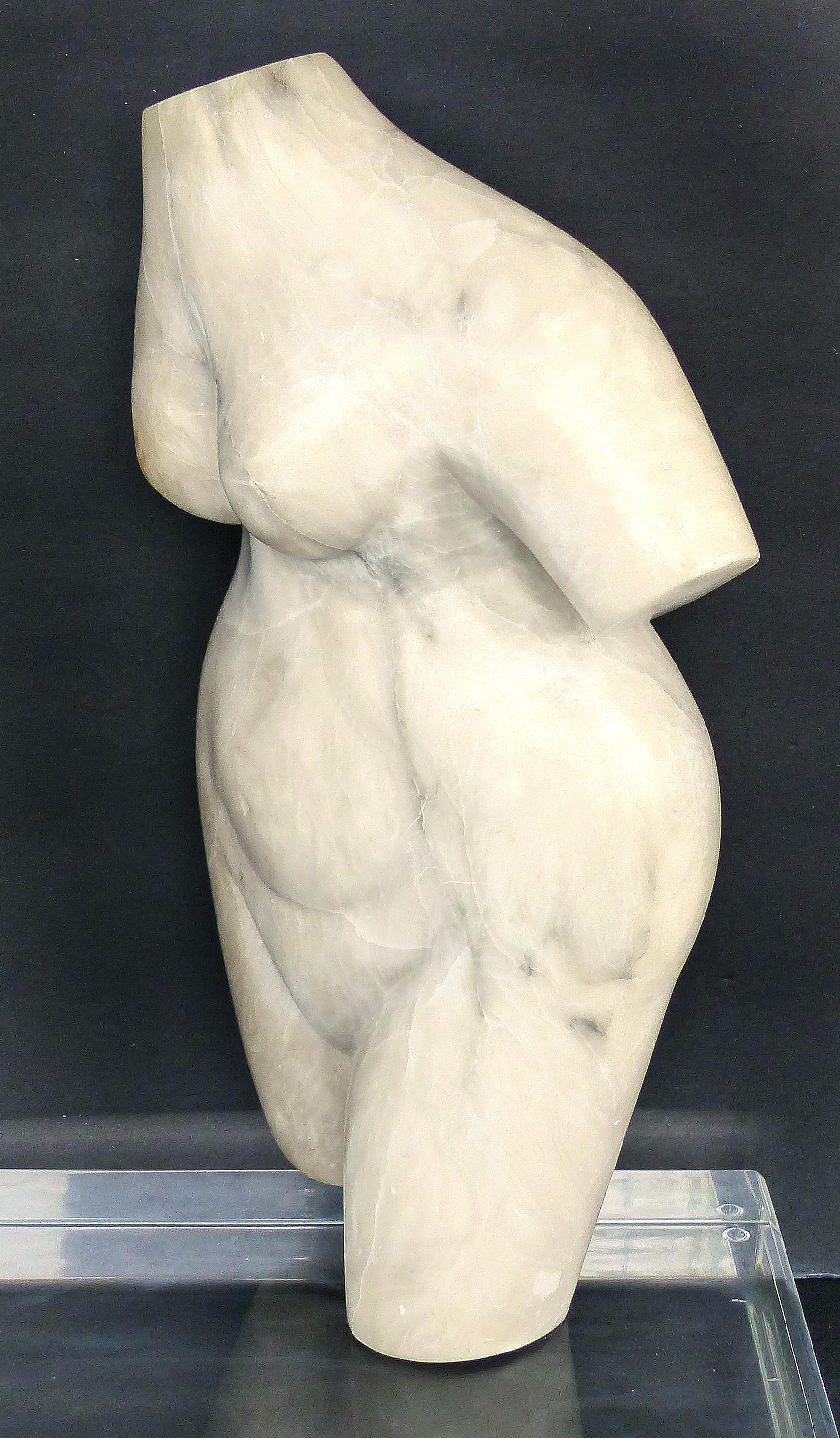 Marble Torso Sculpture on a Lucite Base

Offered for sale is an unsigned carved marble torso sculpture supported by and floating over a thick Lucite base. The marble torso is easily removed from the base and can be positioned as desired by rotating