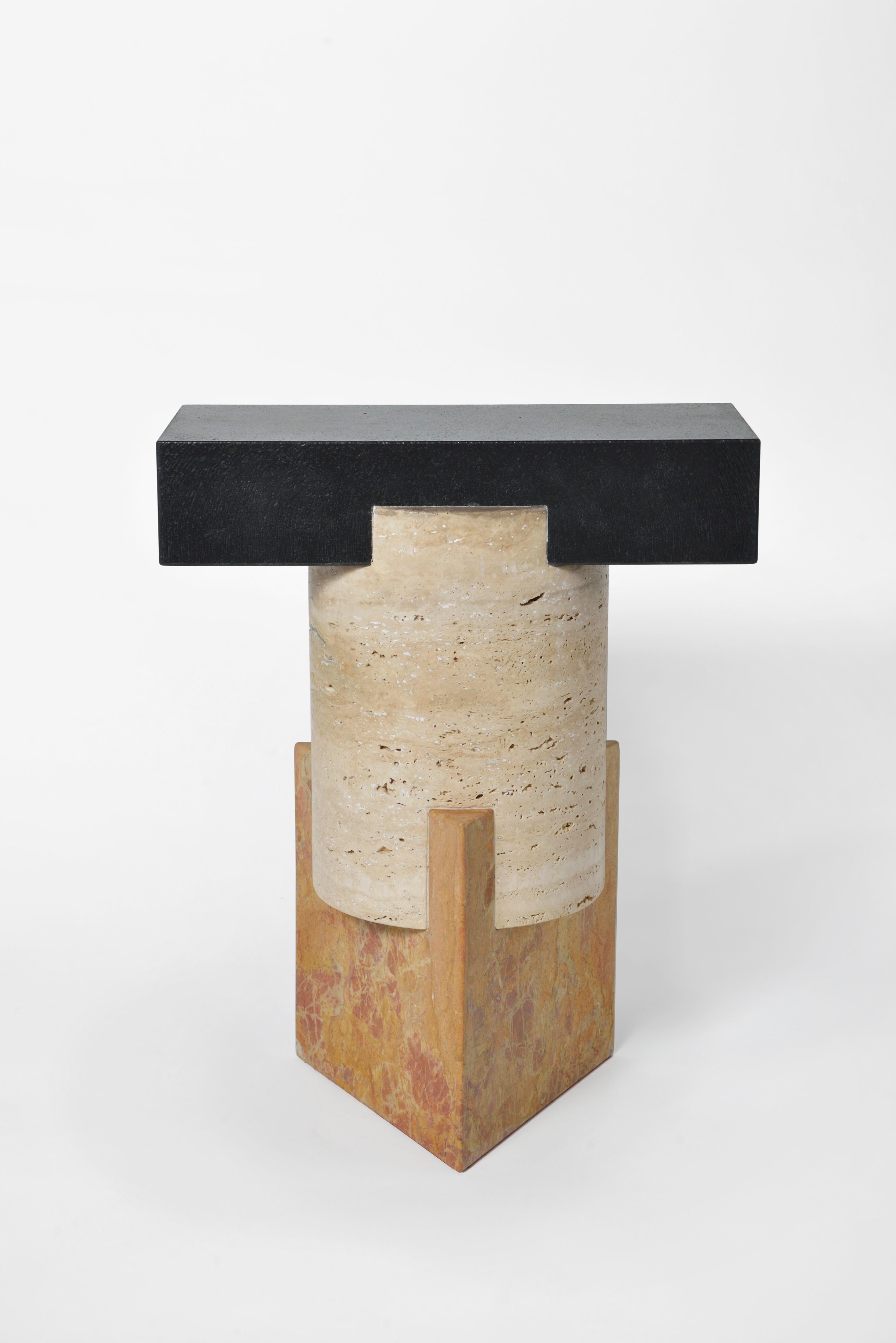 Marble Tuskan stool by Oeuffice
Edition: 12 + 2AP
2014
Dimensions: 34 x 21 x 42 cm
Materials: Nero Assoluto stone, Travertino stone, Giallo Reale marble 

Kapital is a series of limited edition tables and stools based on essential forms,