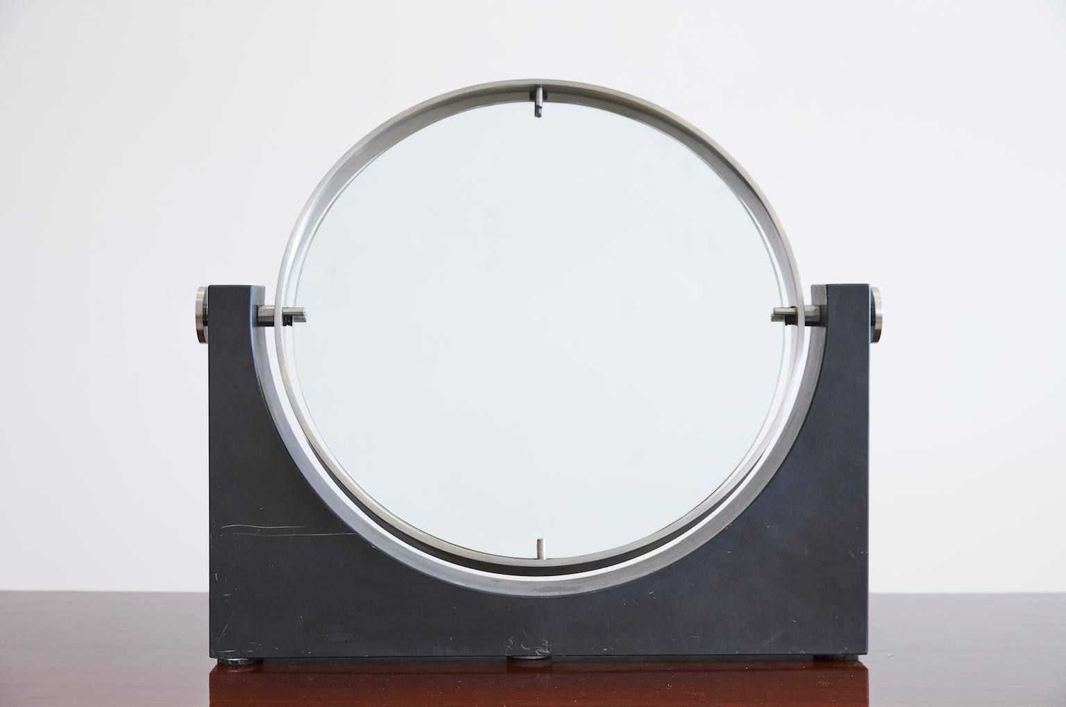 Beautiful marble and stainless steel table top vanity mirror by Angelo Mangiarotti.
Mirror pivots and is beautifully made. 
For your consideration a vintage modern table mirror in black marble and stainless steel. Made in Italy, circa 1970s. 
Mirror