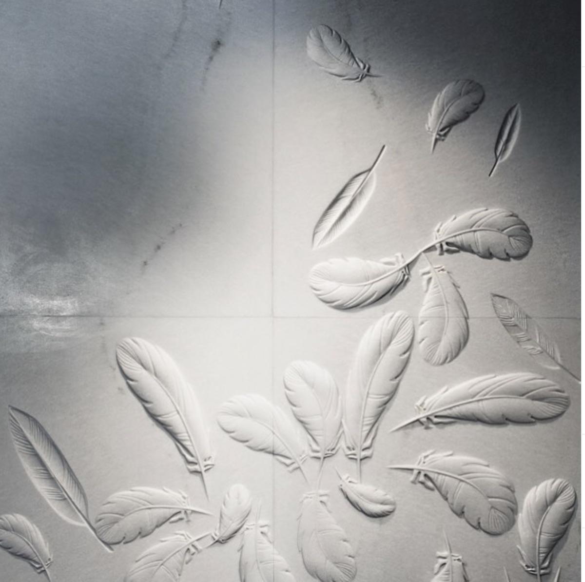 Plumage is created in pure white marble as an architectural element that takes craftsmanship to the next level of luxury. Wall panels are poetry in marble, telling about the most temperamental moments of nature's life. 

The Plumage or feather wall