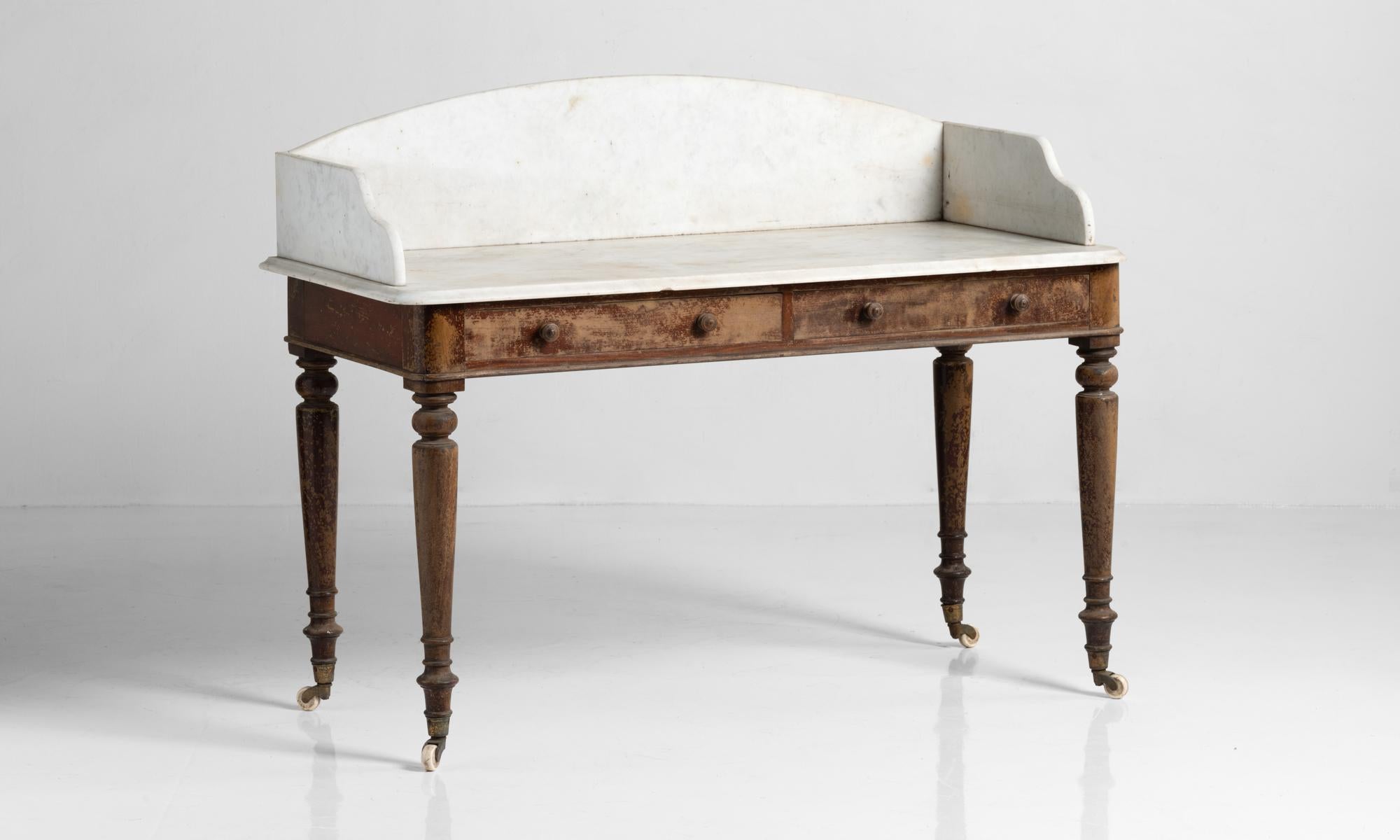 Marble washstand, England, circa 1860.

Elegant washstand with marble top, on wooden base with handsome turned legs on original castors.

 