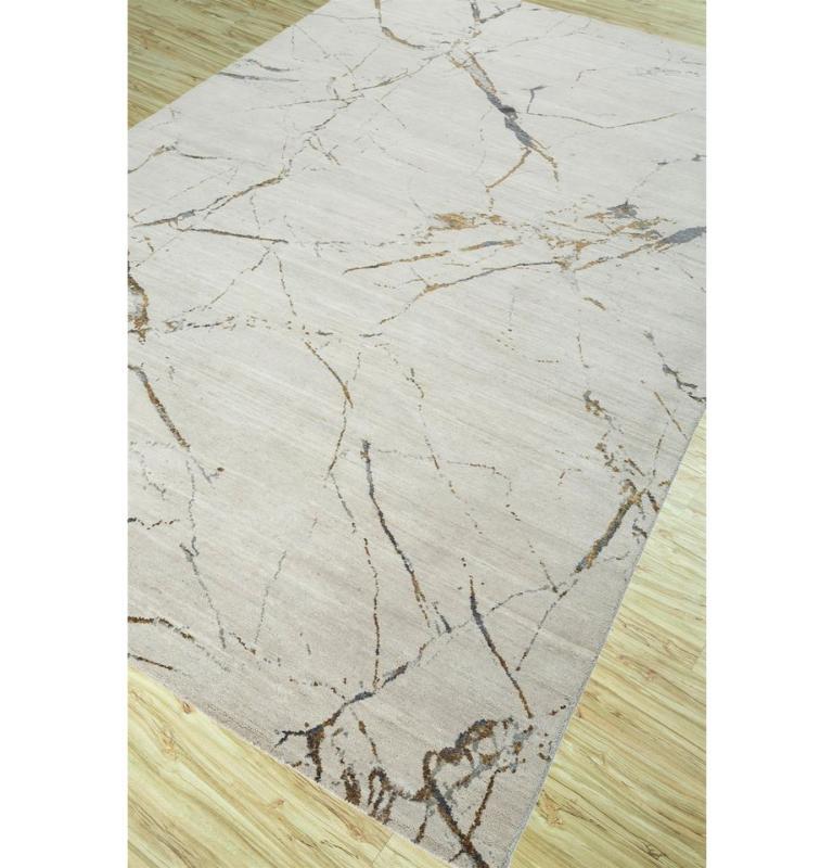 This hand-knotted masterpiece from our Urban Pause by Kavi collection transcends ordinary floor coverings. The luxuriously soft blend of 70% wool, 20% silk, and 10% cotton yarn showcases the artisanal craftsmanship, ensuring both durability and a