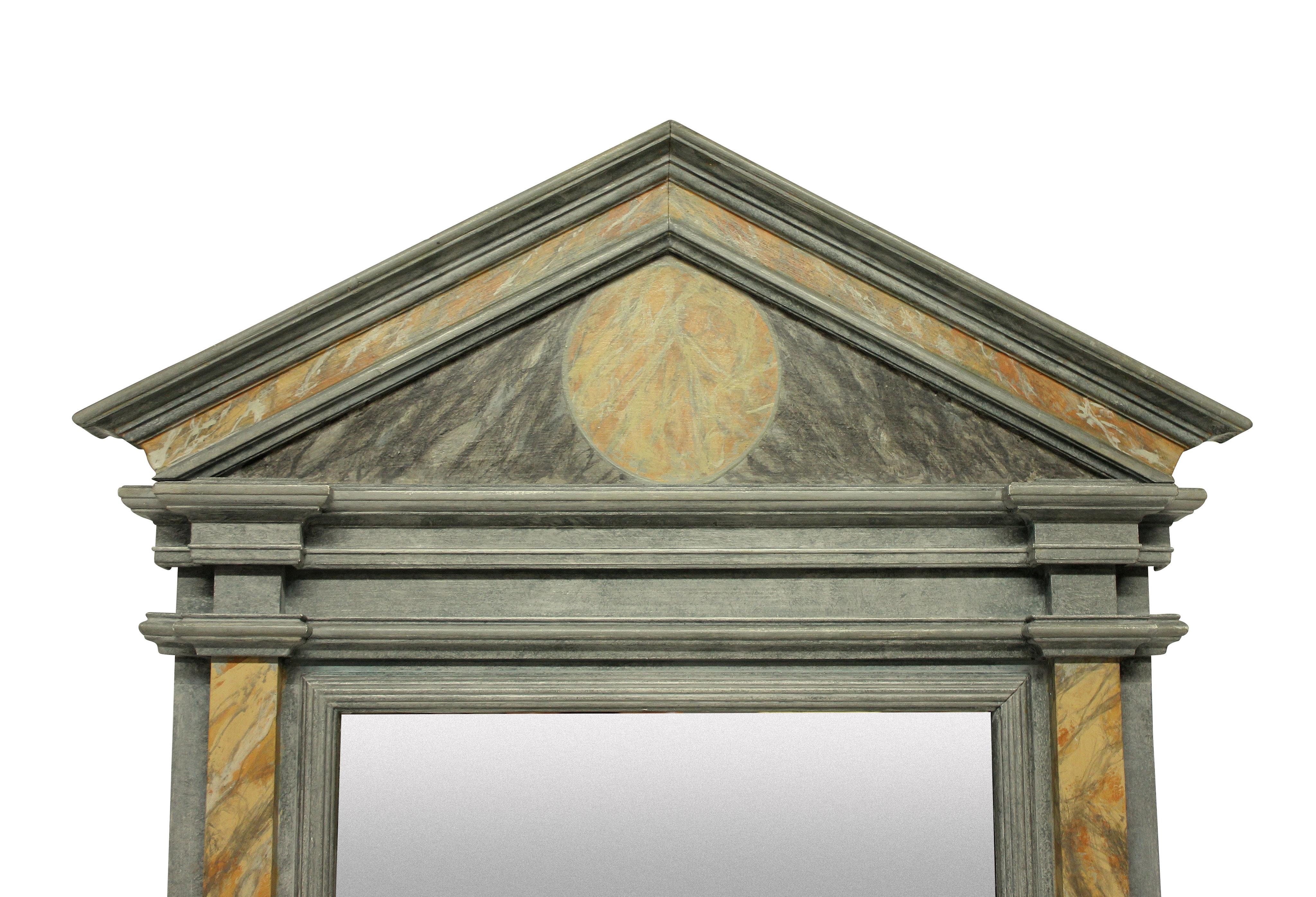 An English marbled architectural Roman style mirror, with faux Sienna and grey marbling and a bevelled mirror plate.