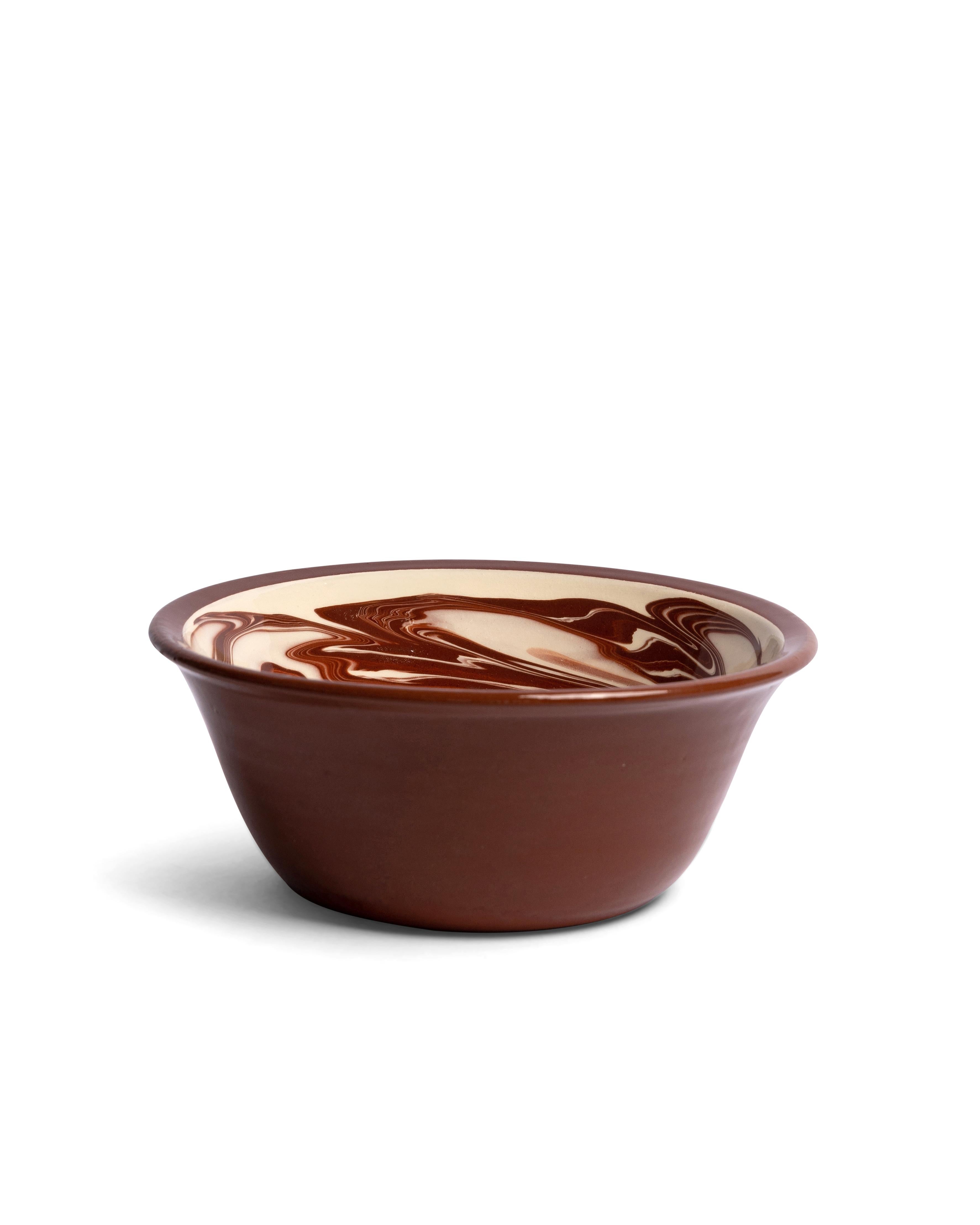 Handcrafted in Bulgaria, our Marbre collection brings a rustic elegance to any table setting, with its dreamy marbled pattern. Available in blue, green and brown, the Marbre collection comprises of dinner plates, side plates, large bowls, small