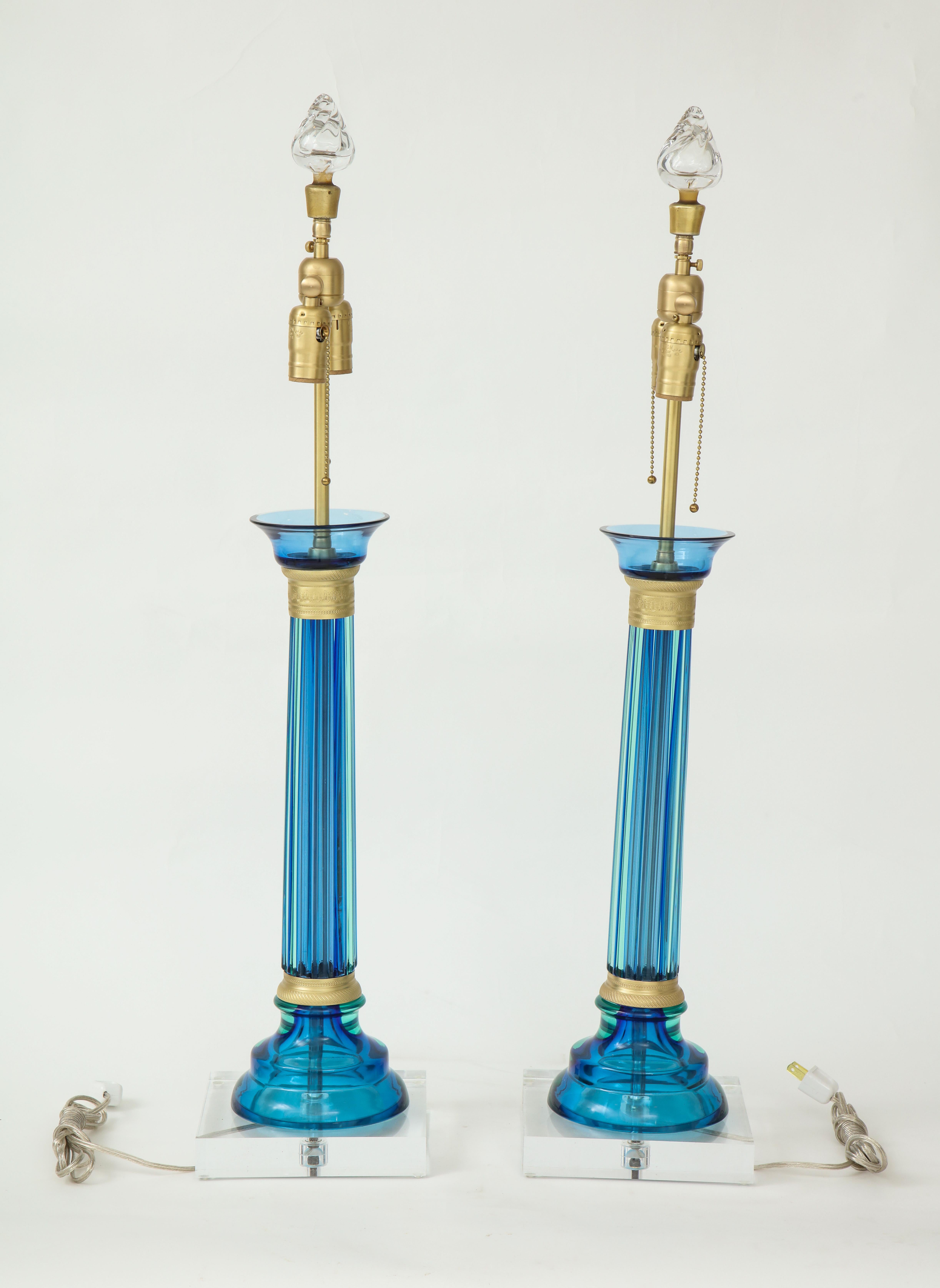 Pair of midcentury Murano glass lamps in a fresh Caribbean blue color with brass hardware and sitting on Lucite bases. Rewired for use in USA. Seguso glass for Marbro Lamp Co.