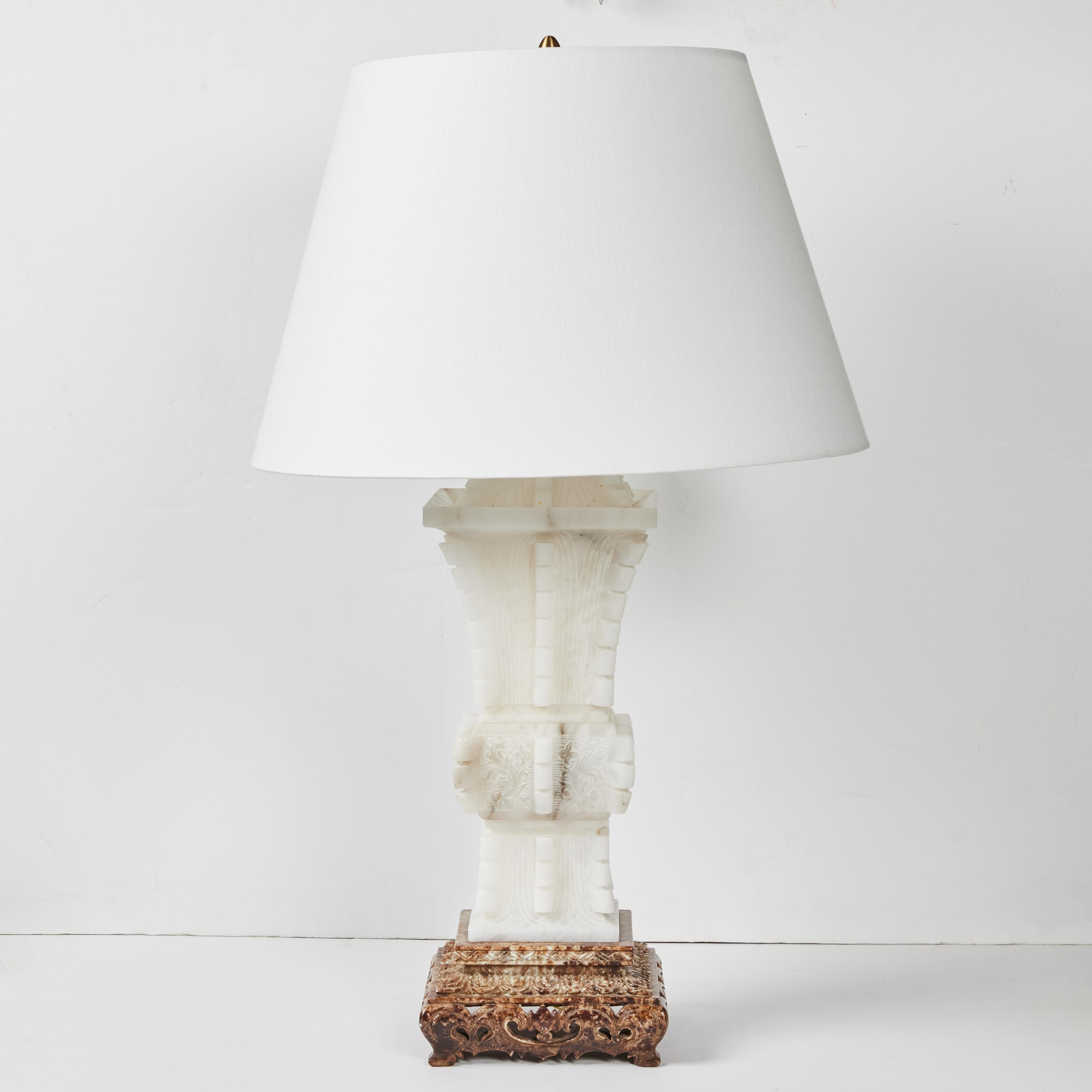 Solid alabaster lamp, hand carved in Italy, in Chinoiserie style by Marbro Company.  Lamps are sold separately and are slightly different heights noted below.  Alabaster is 22