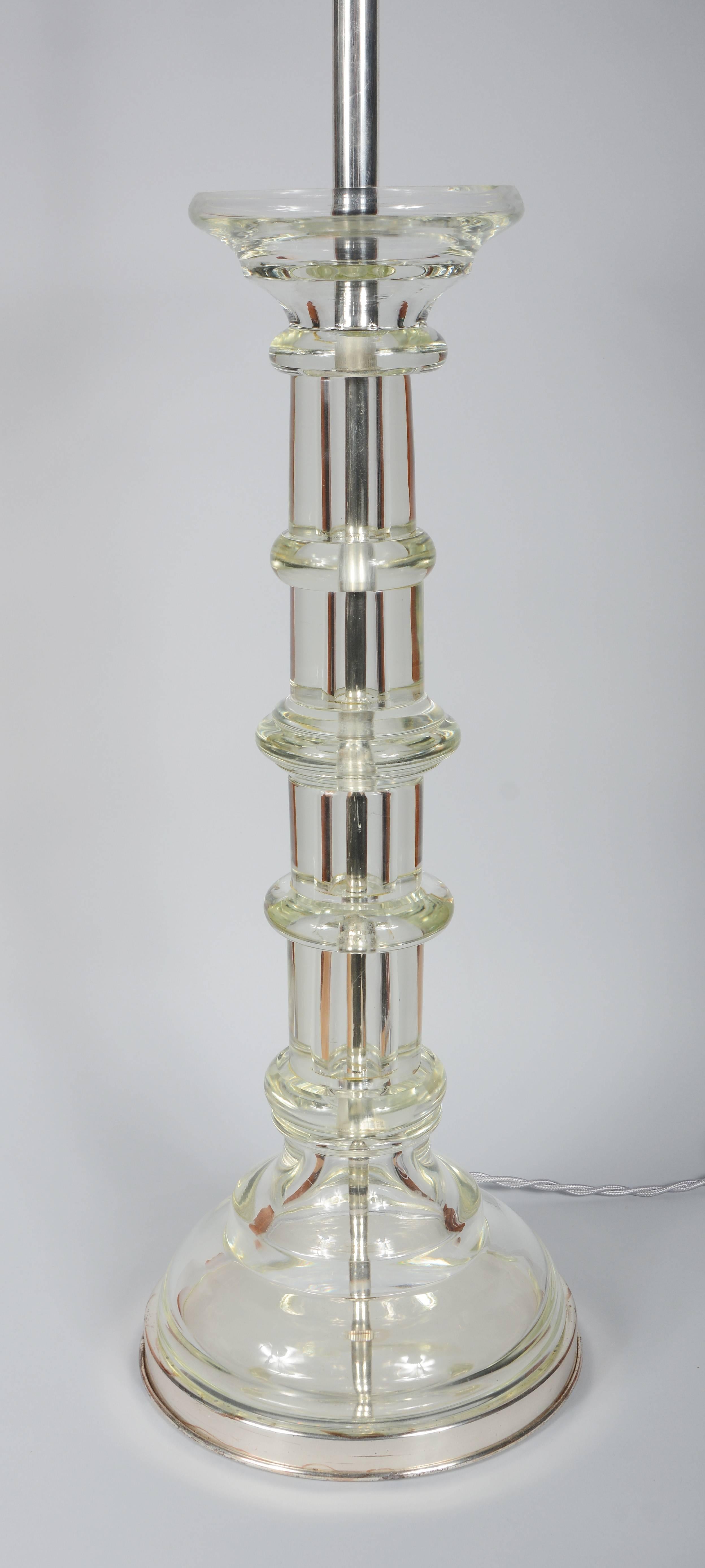 Tall glass column table lamp by Marbro. The metal components on this lamp are silver plated with exception of the pull chains. The lamp has a new twisted silver rayon cord.