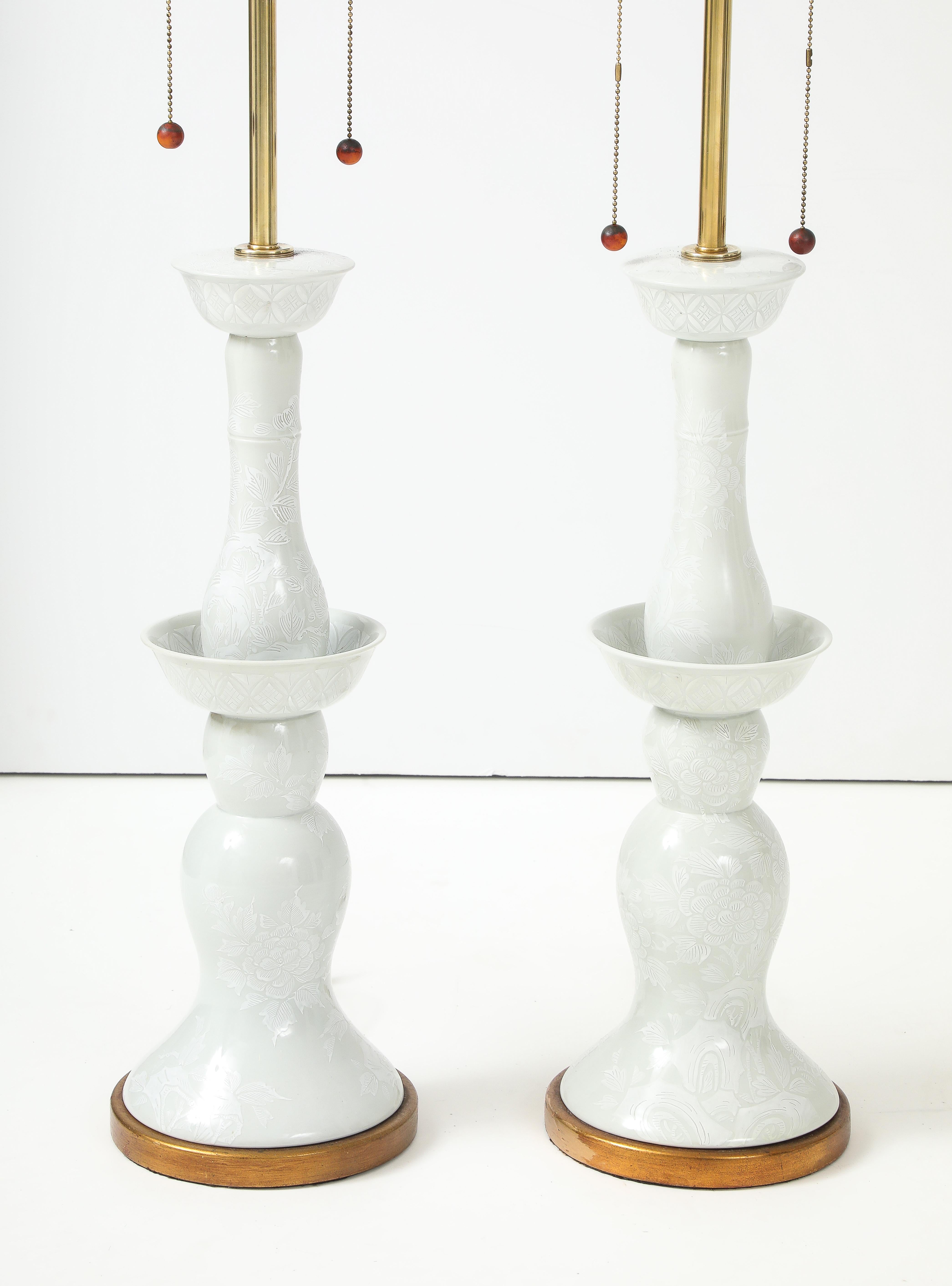 Fabulous pair of Large 1950's porcelain brass and giltwood bases table lamps by The Marbro Lamp Company, lightly restored and newly rewired in silk wired, with minor wear and patina due to age and use.