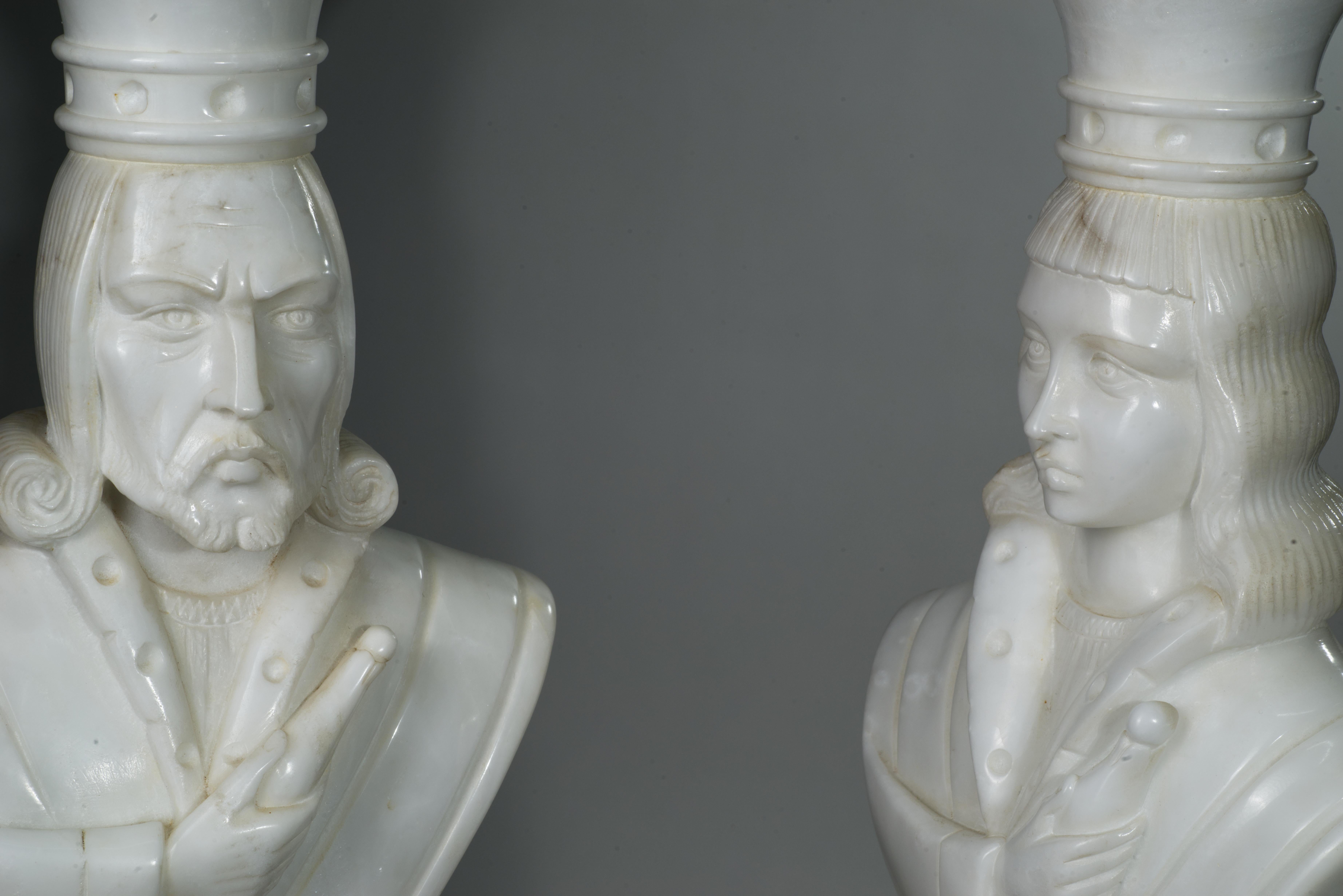 Pair of monumental oversized table lamps was created by Marbro, most probably as a custom order. 
Tall, sculptural, highly detailed figures of king and queen from a chess set are hand-carved in Art Deco style white marble and alabaster and mounted