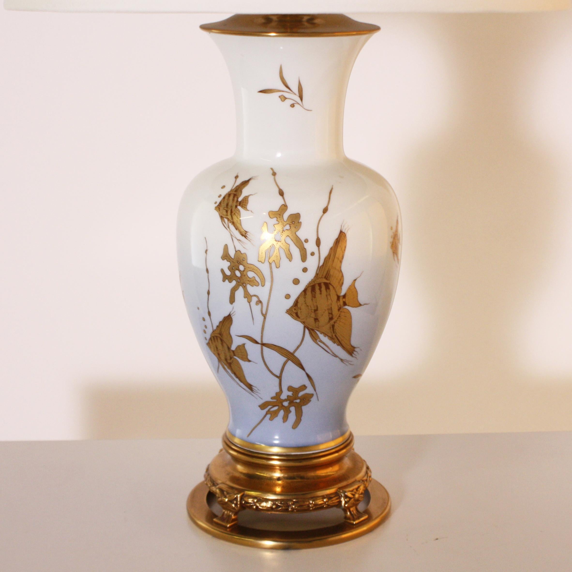 Marbro porcelain Angelfish lamp, circa 1960

Custom linen shade, crystal ball finial, gold twisted cording.