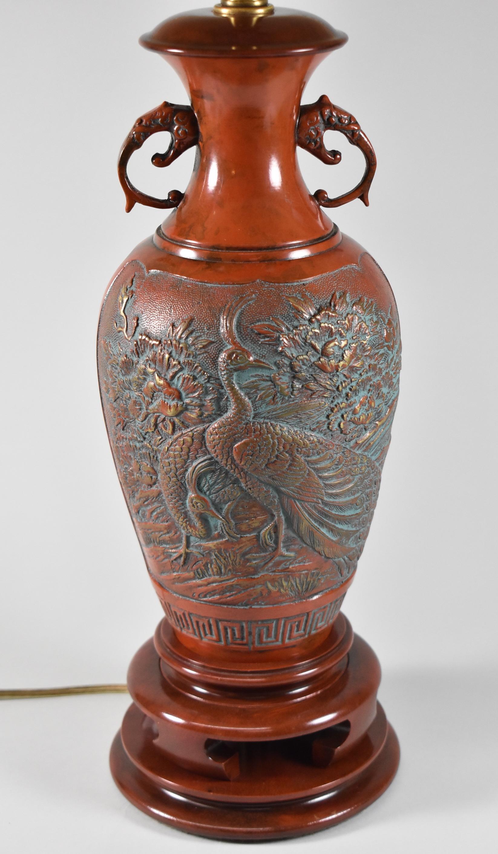 Marbro lamp with carved Asian designs of peacocks and foliage. Original finish. Good wiring. Shade is not included.