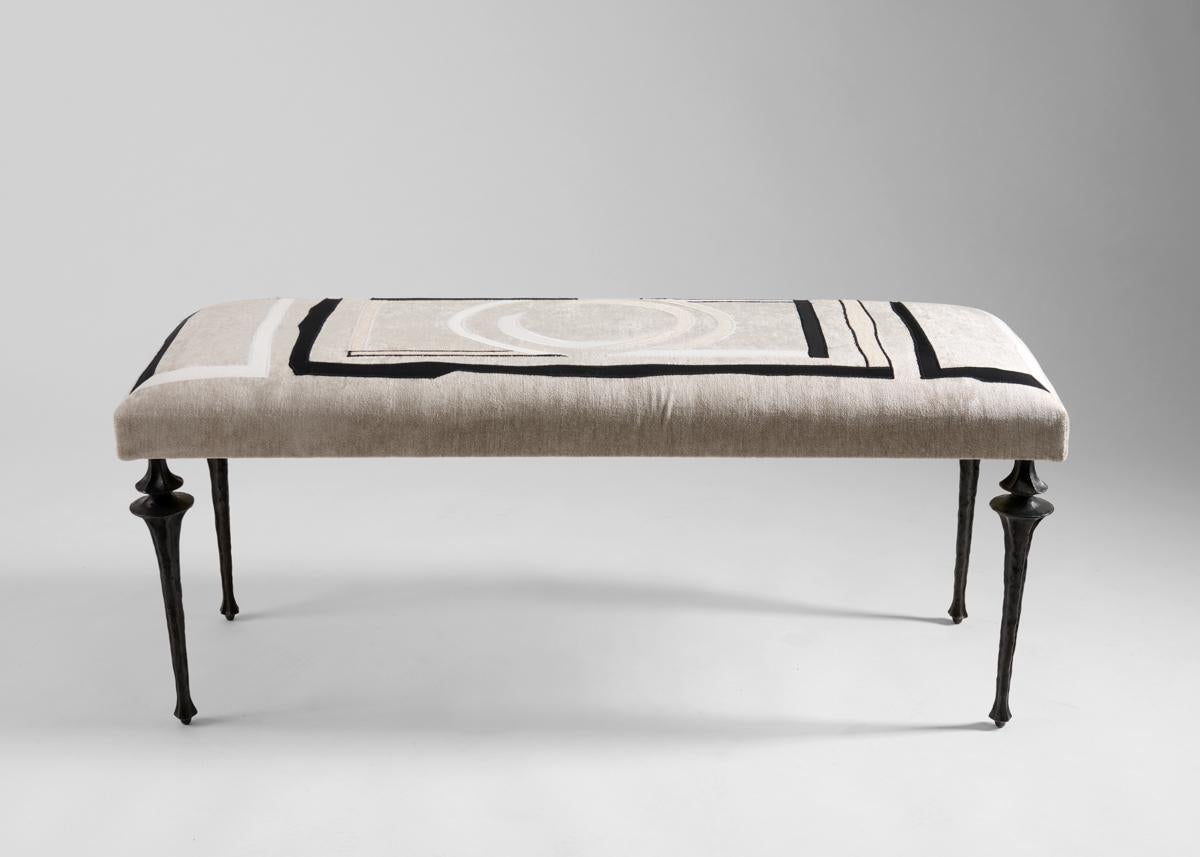 This long Nijinksy bench features a set of eight newly designed legs by Marc Bankowsky in patinated bronze. The plush seat is upholstered in fabric embroidered by the Chilean-born Miguel Cisterna, whose work imbues the classical French tradition of