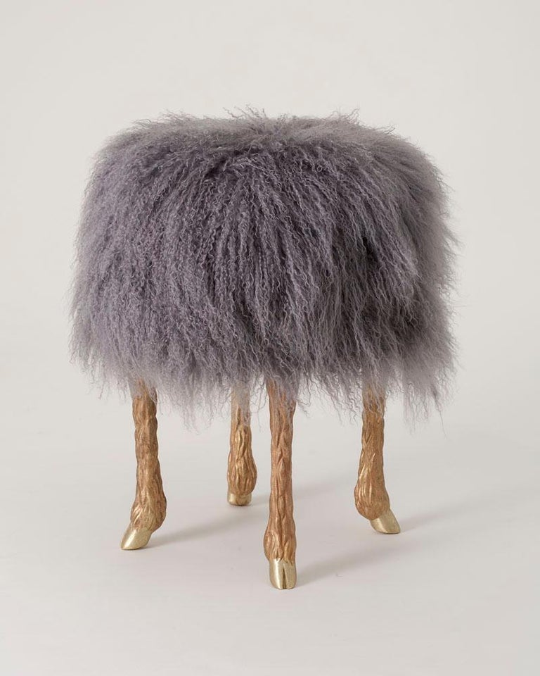 Contemporary stool by Marc Bankowsky. Upholstered in Mongolian lamb with bronze legs.