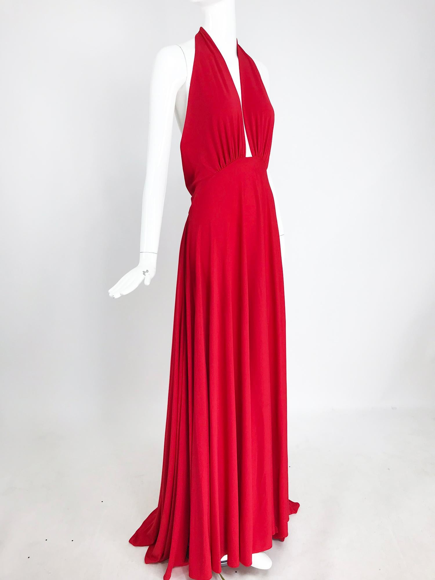 Marc Bouwer matte red jersey plunge halter dress, super model length. Gorgeous fire engine red dress in an interesting cut, not a typical halter dress. The bodice halter slips over the head, there are no ties or hooks. The bodice front is open to