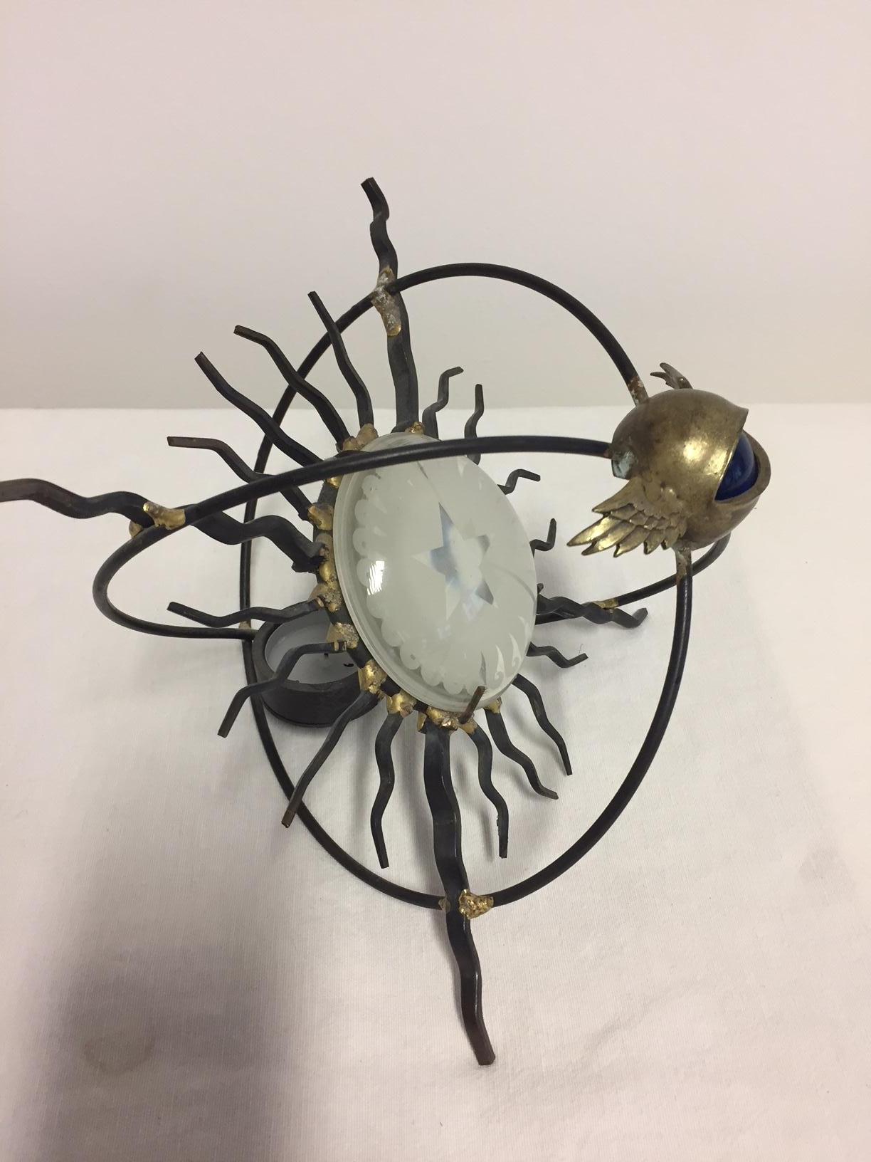 Decorative candle light holder by Marc Brazier Jones, with engraved glass and blue glass ball as the centre of the eye, wrought iron and bronze, gilded details, this style is only available as vintage item, no longer produced by the artist.